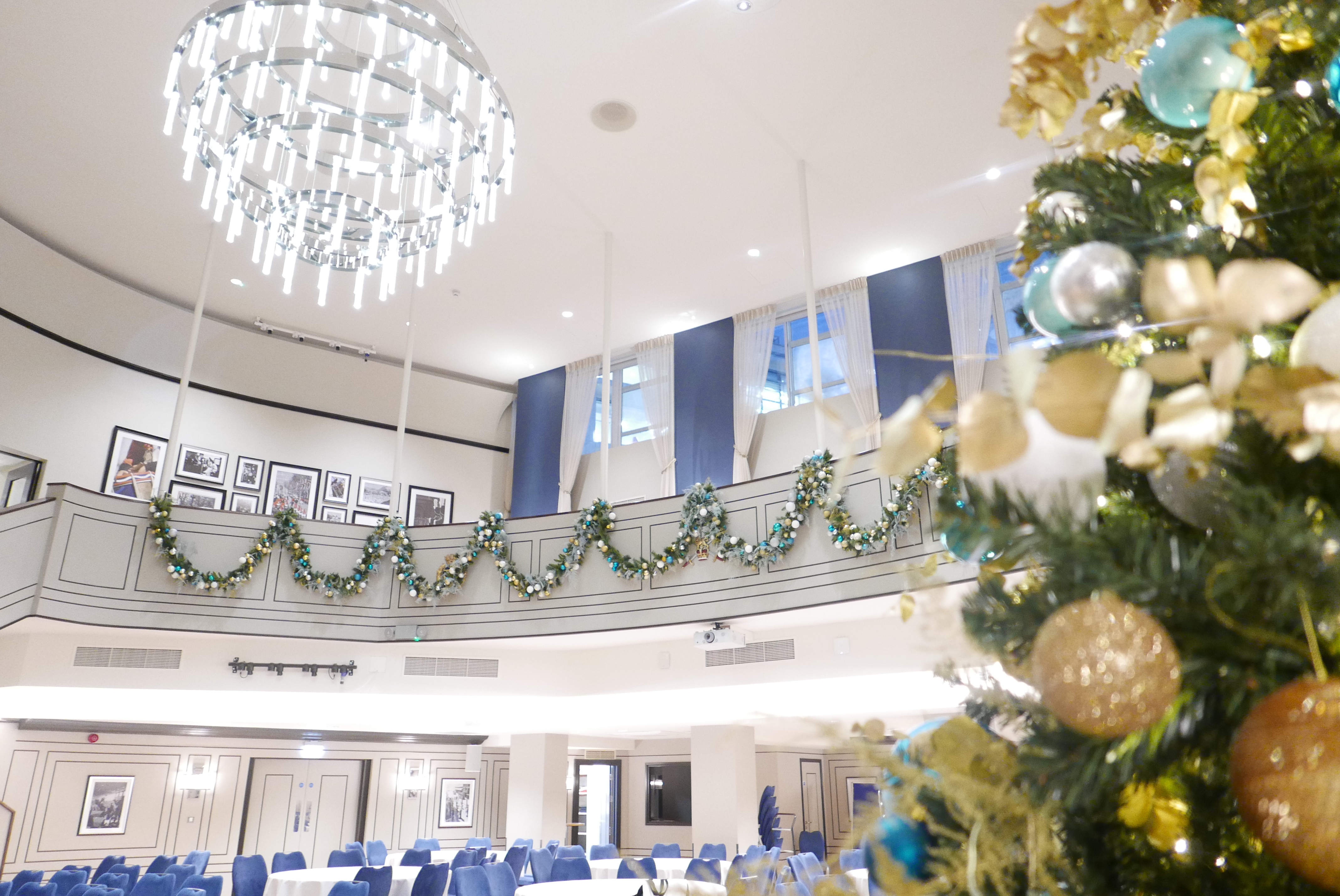 Carisbrooke Hall at Victory Services Club, elegant chandelier, festive event space.
