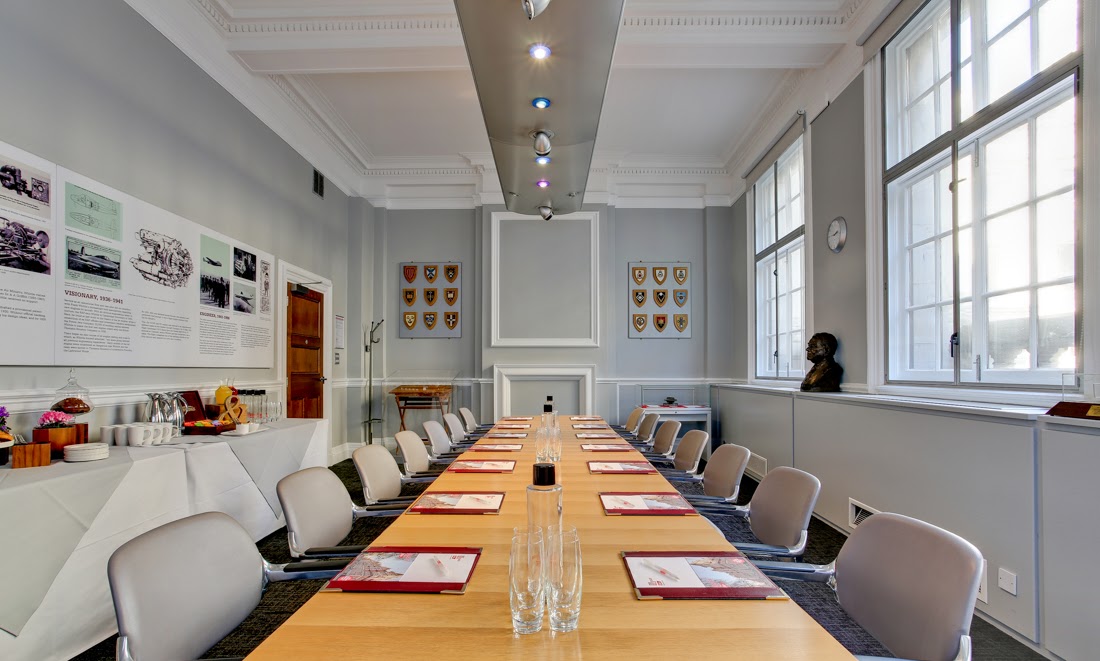 Frank Whittle in a bright, elegant meeting room for corporate discussions and workshops. - Banner