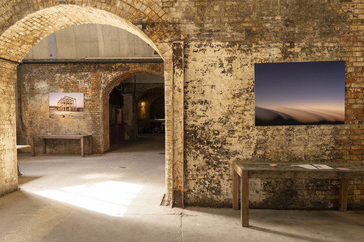 Rustic event space with exposed brick walls, ideal for creative gatherings and exhibitions.