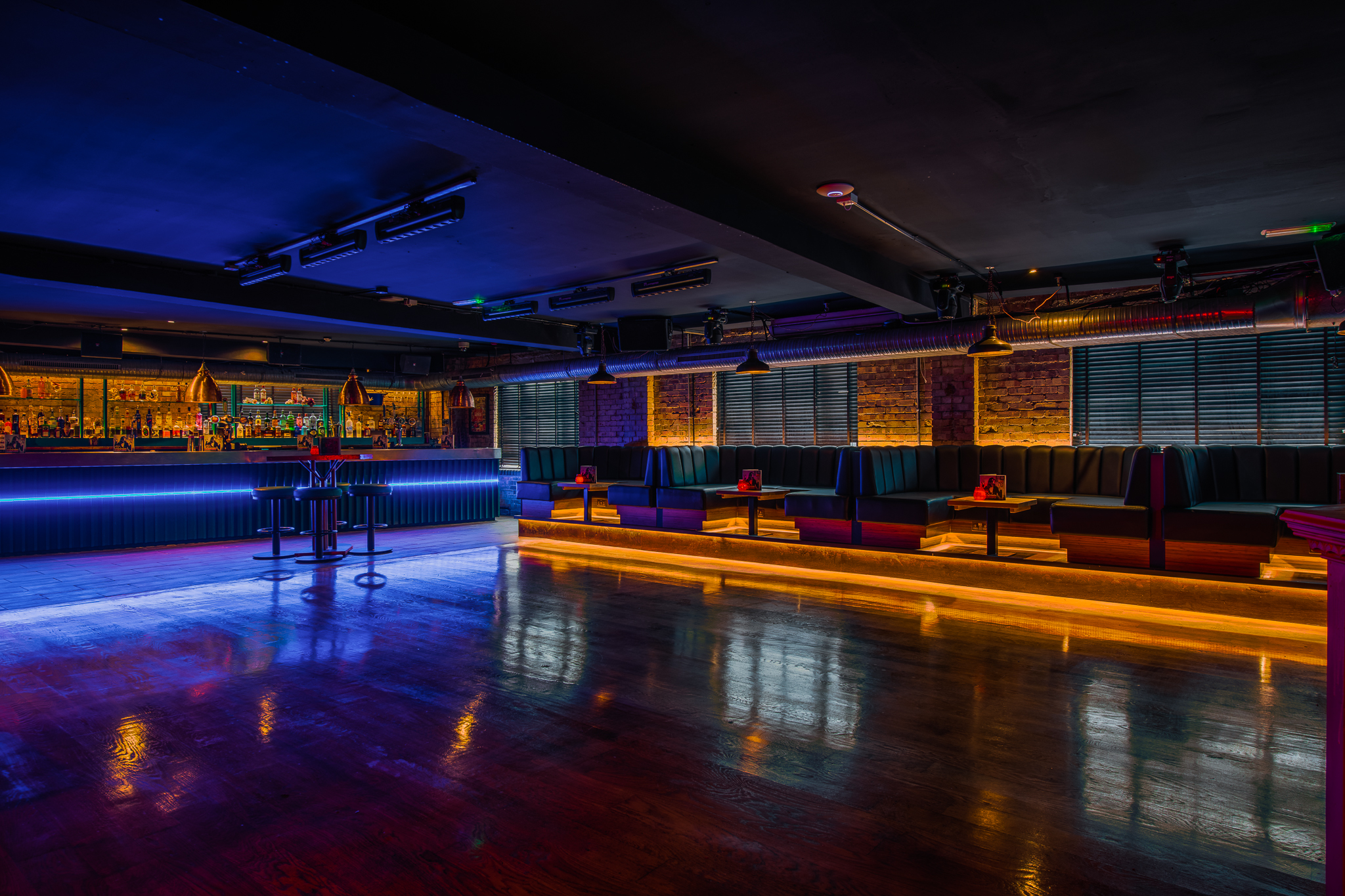 Stylish event space with modern bar and ambient lighting in Revolution Southampton.