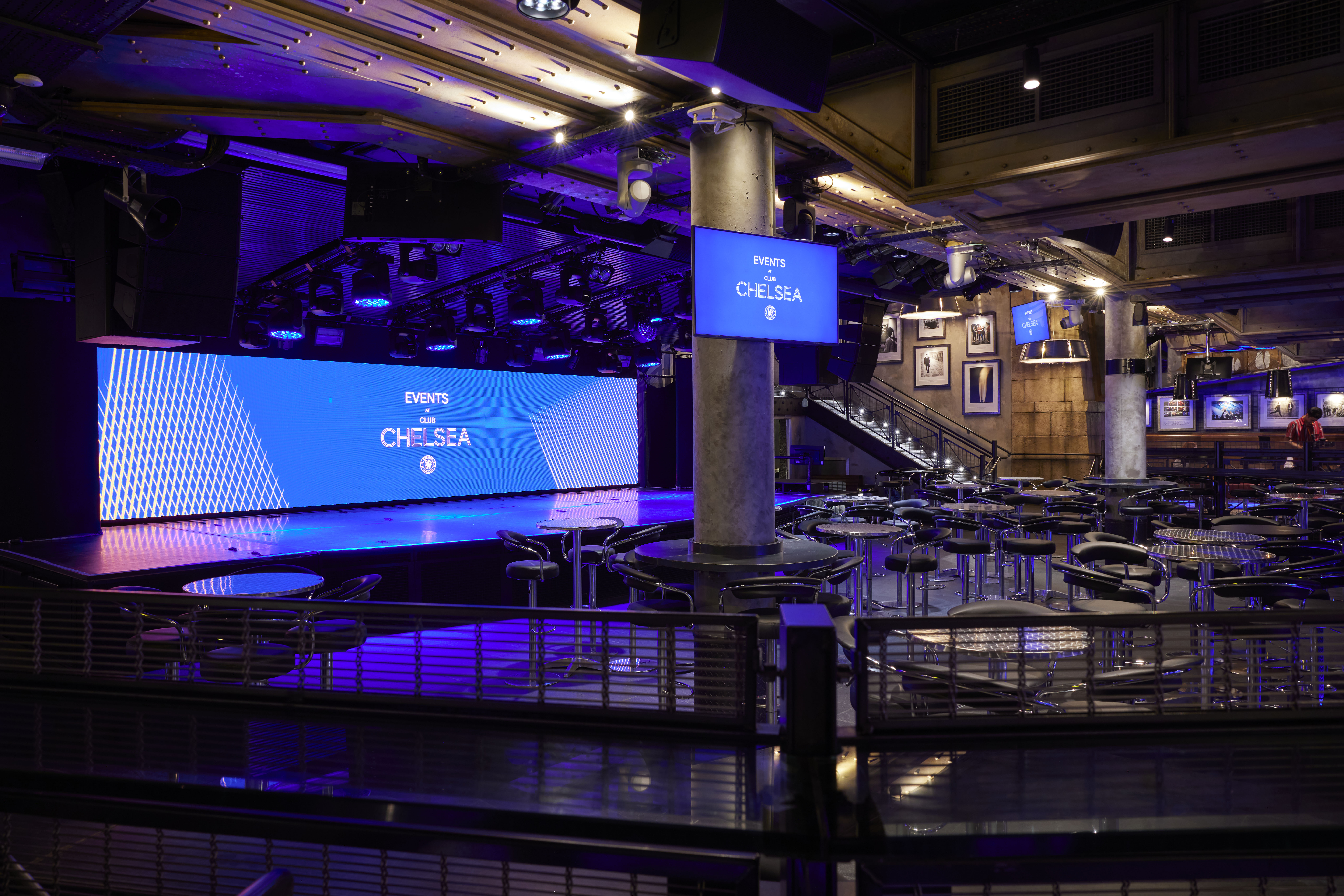 Modern event space at Chelsea FC with customizable stage for corporate gatherings.