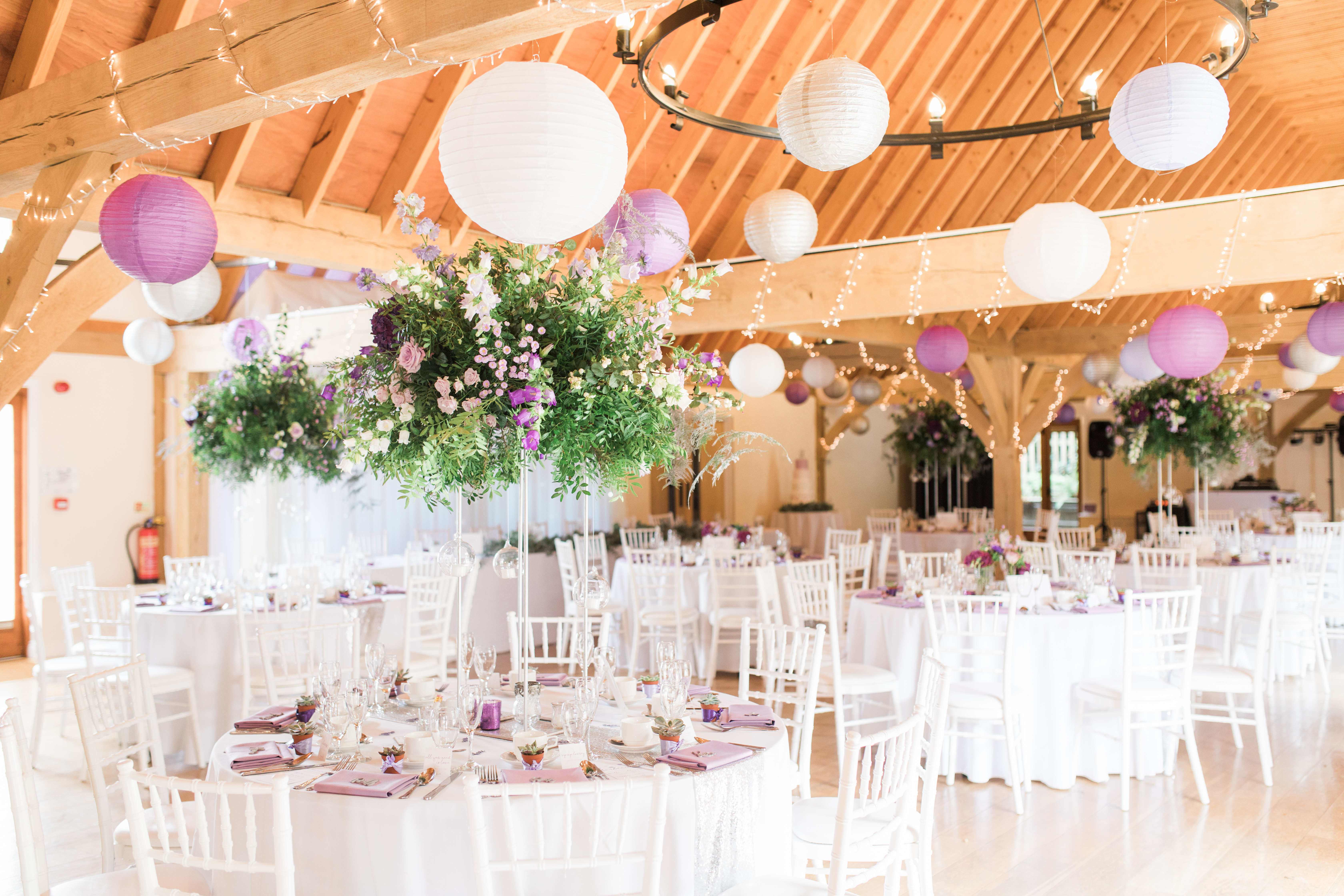 Cobbold Barn event space with elegant tables, ideal for weddings and upscale gatherings.