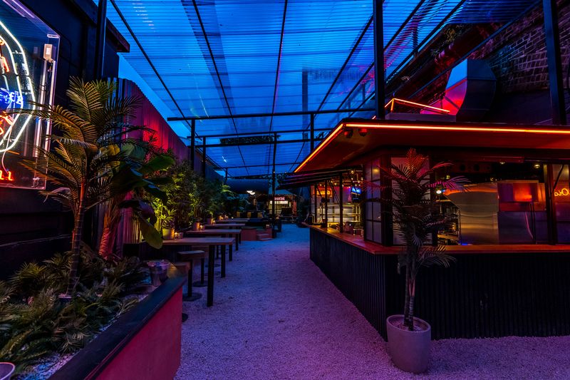 Vibrant outdoor event space with lush greenery at Night Tales venue hire.