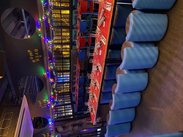 Rubell's Karaoke Room in HUCKSTER London, vibrant festive space with colorful decor.