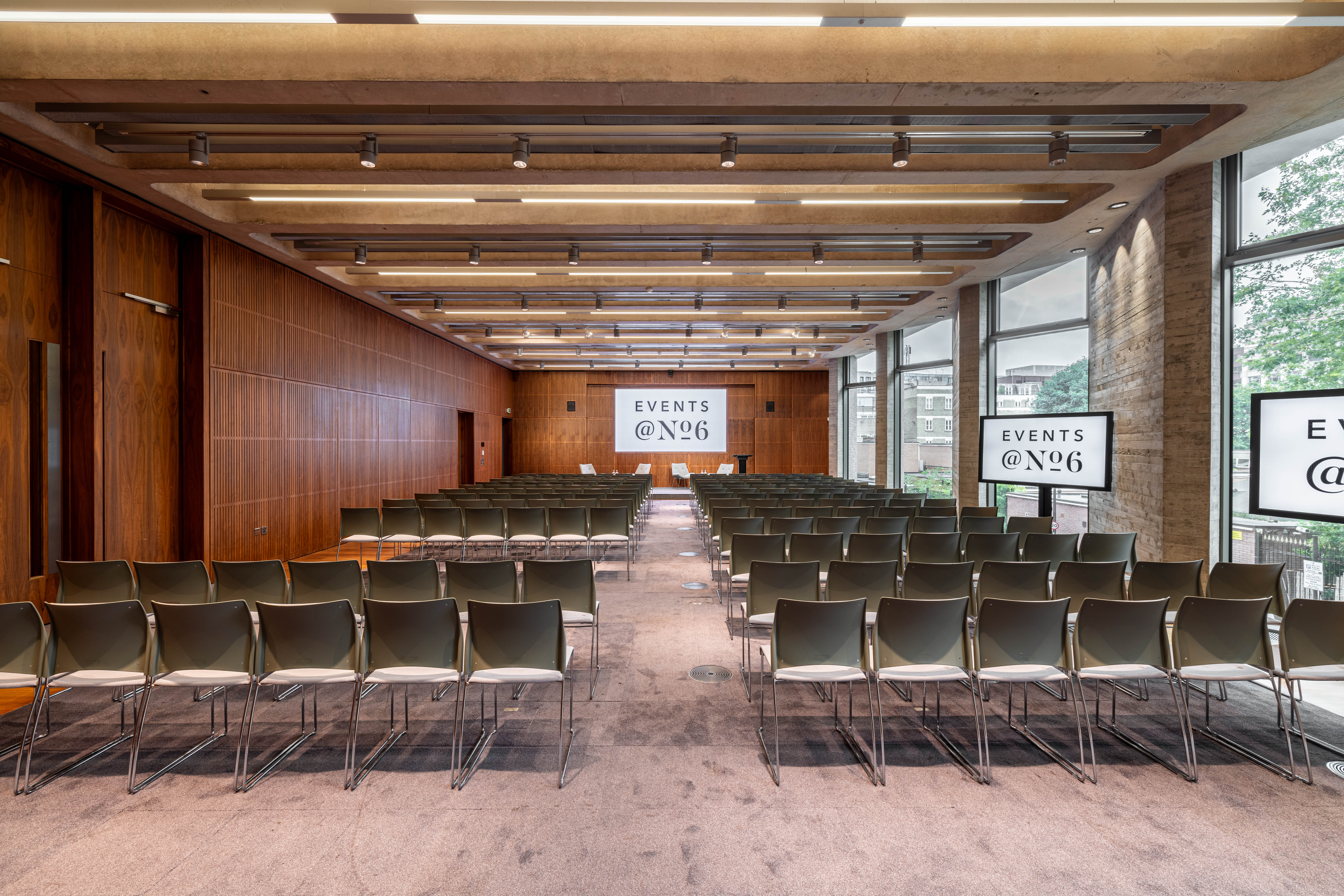 Modern event space with sleek chairs, ideal for presentations and conferences.