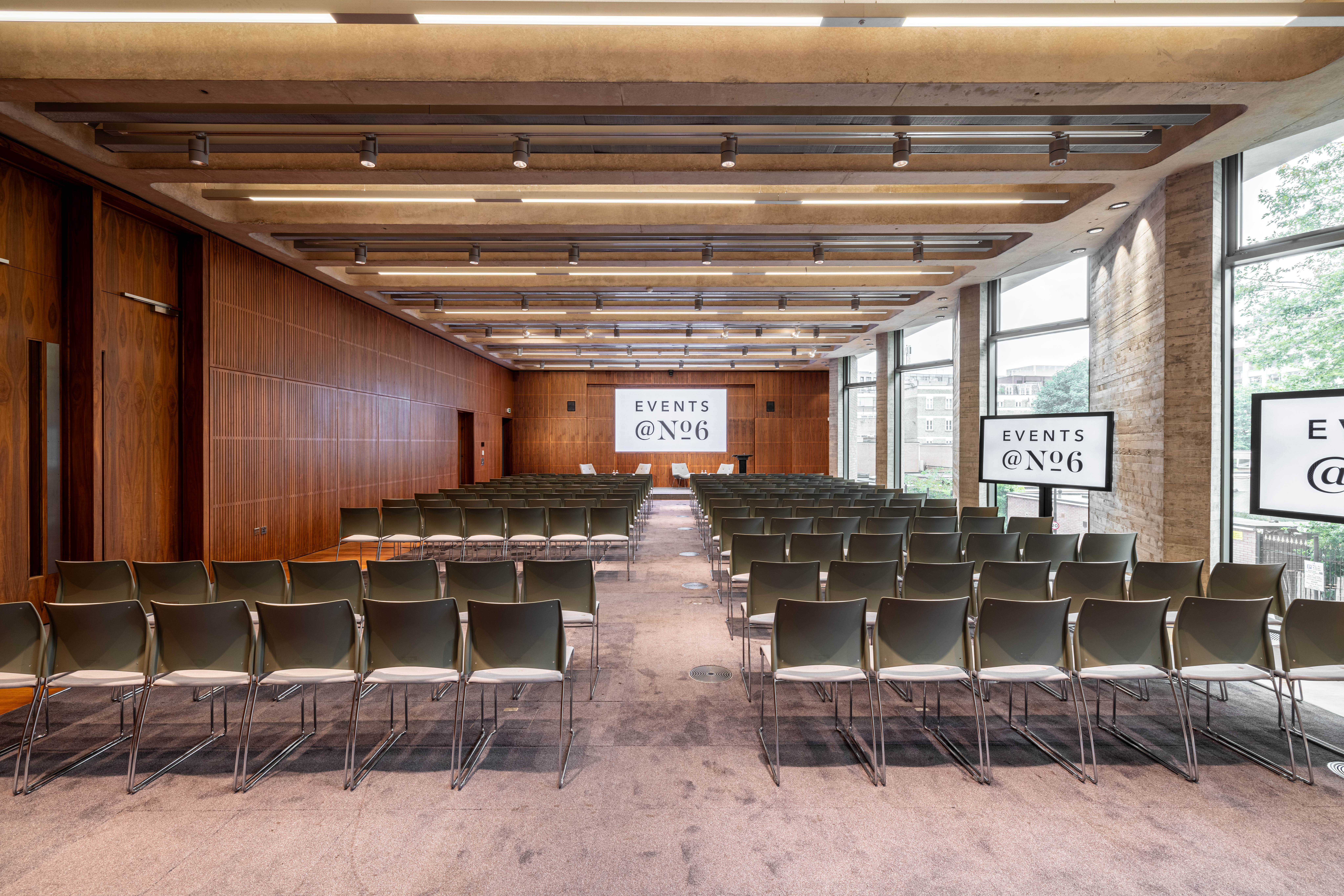 Modern event space with organized chairs, perfect for presentations and workshops.