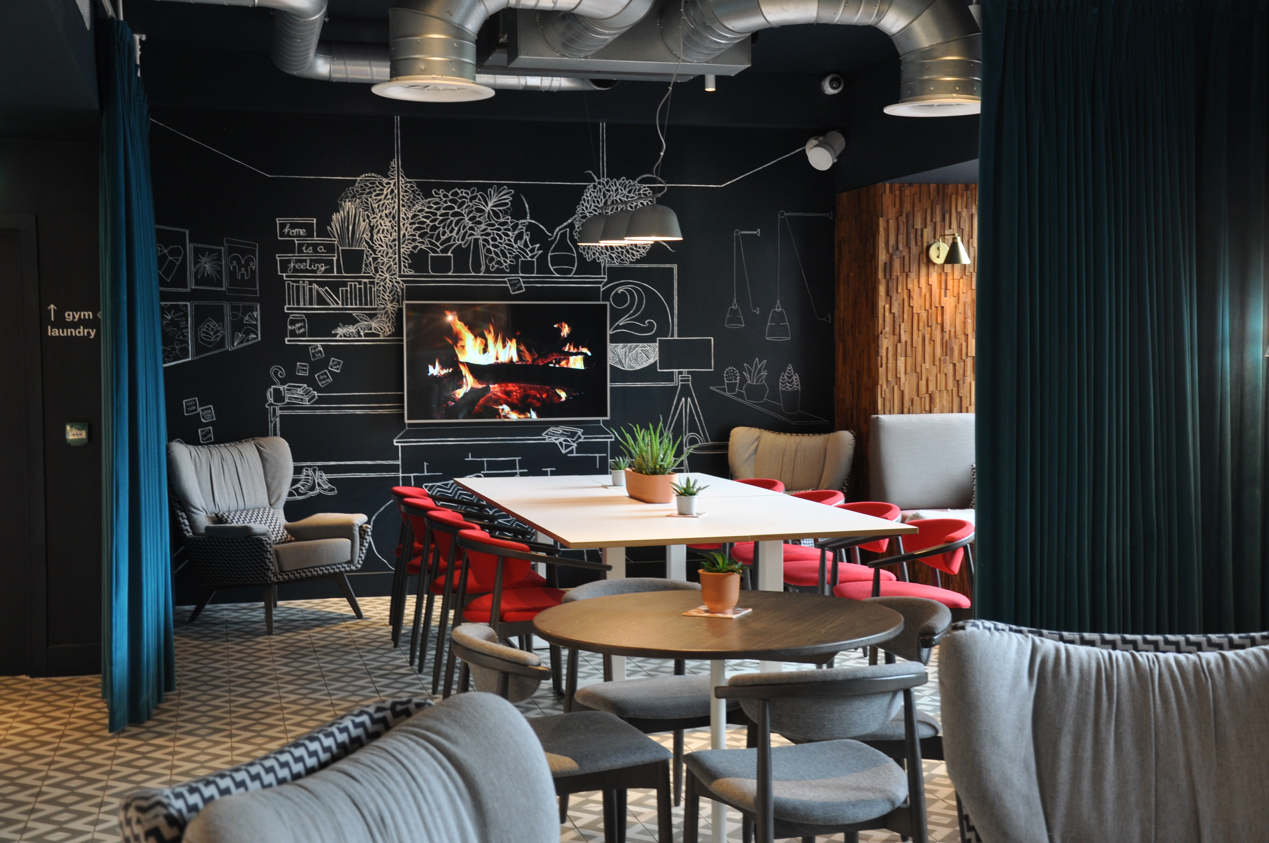 Versatile meeting space with cozy fireplace for creative brainstorming sessions.