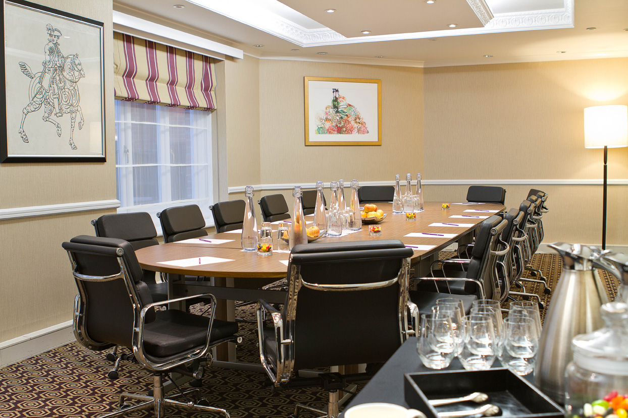 Windsor Suite meeting room at St Ermin’s Hotel with oval table, ideal for conferences.