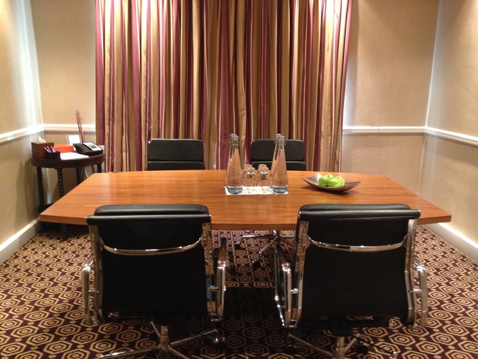 Meeting room at St Ermin’s Hotel with sleek wooden table for professional gatherings.