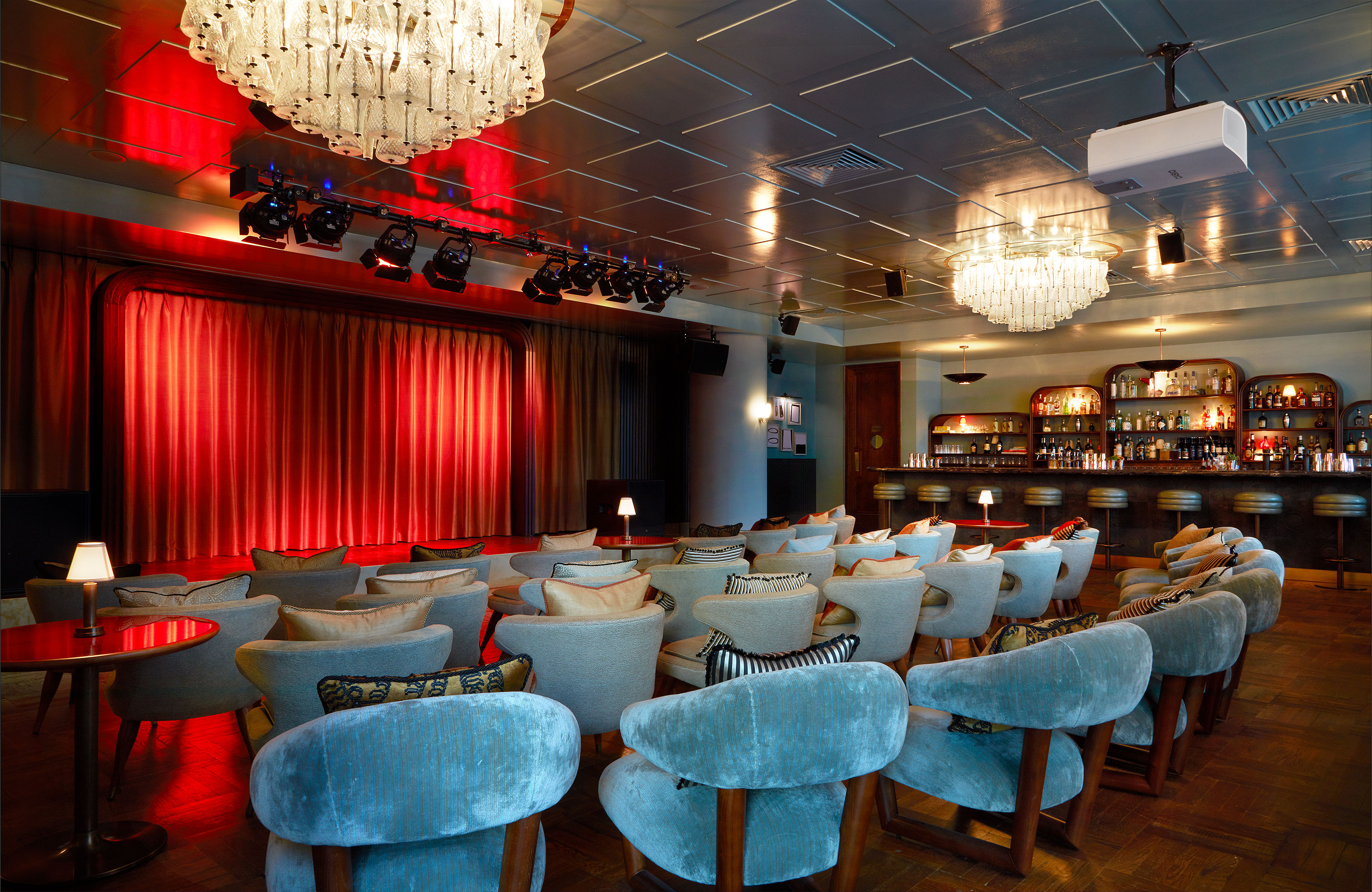 Stylish event space with plush seating for presentations and performances in White City Studio. - Banner