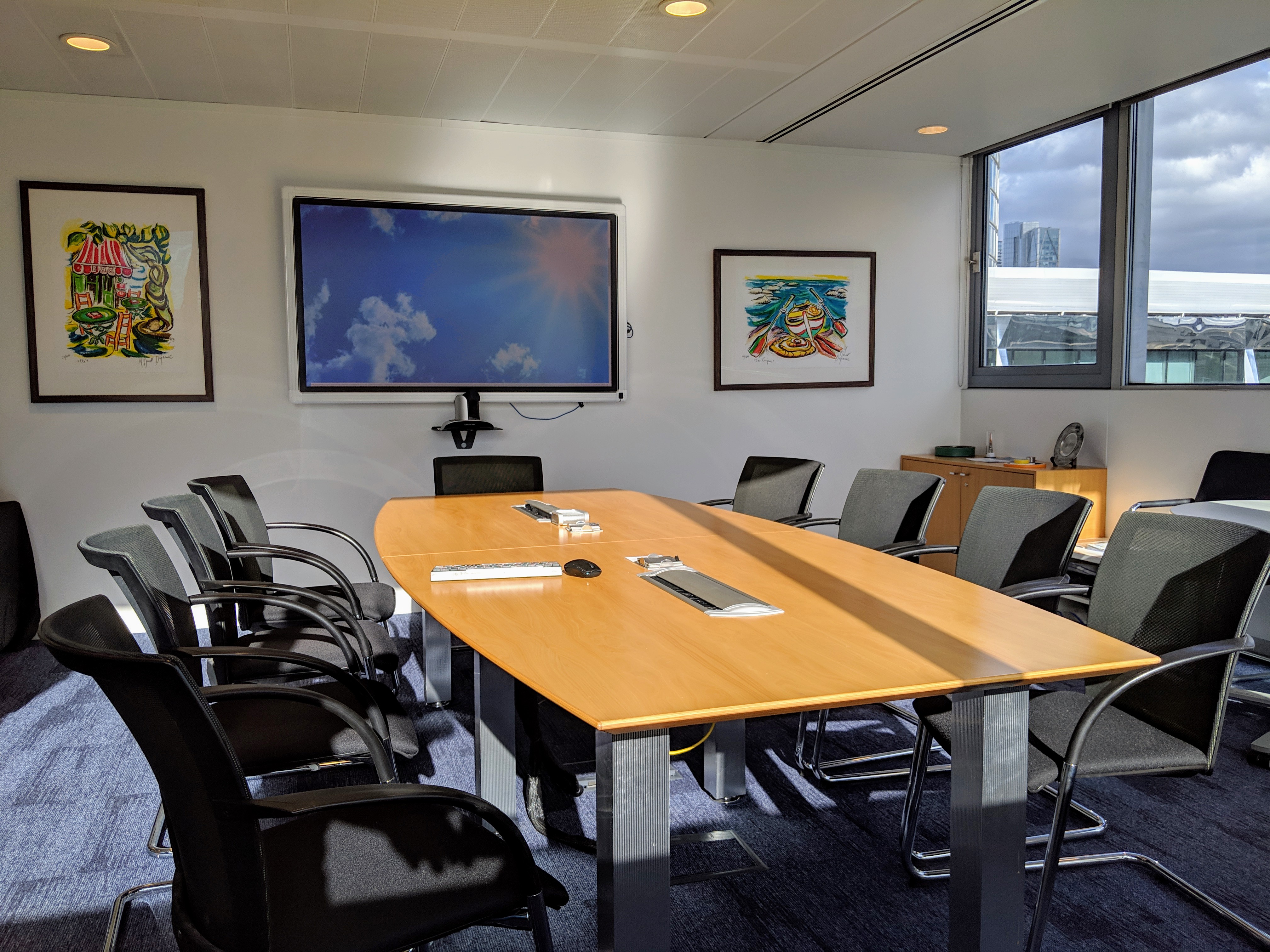 Modern 10th Floor Board Room with large table, ideal for meetings and presentations.