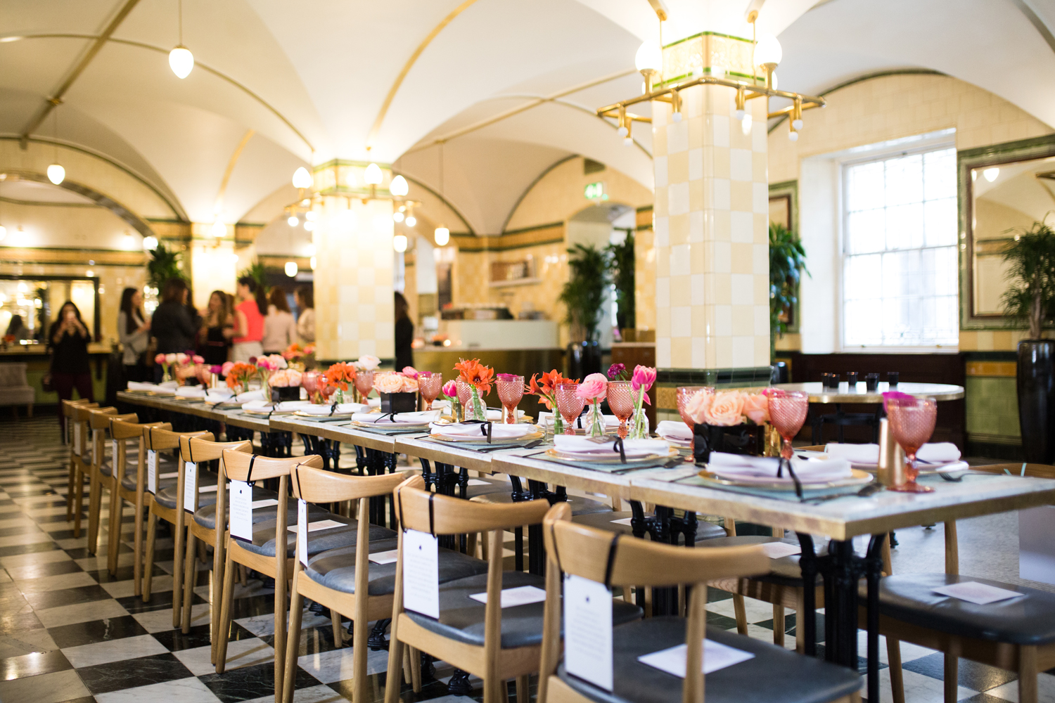 Elegant dining space at Café Duke, featuring floral centerpieces for corporate events.
