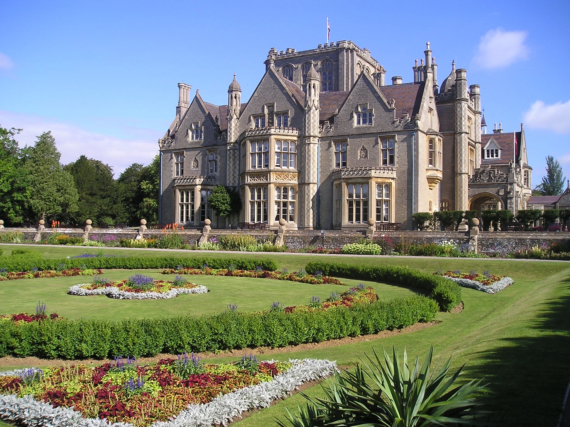 Historic De Vere Tortworth Court mansion with lush gardens, ideal for weddings and corporate events. - Banner
