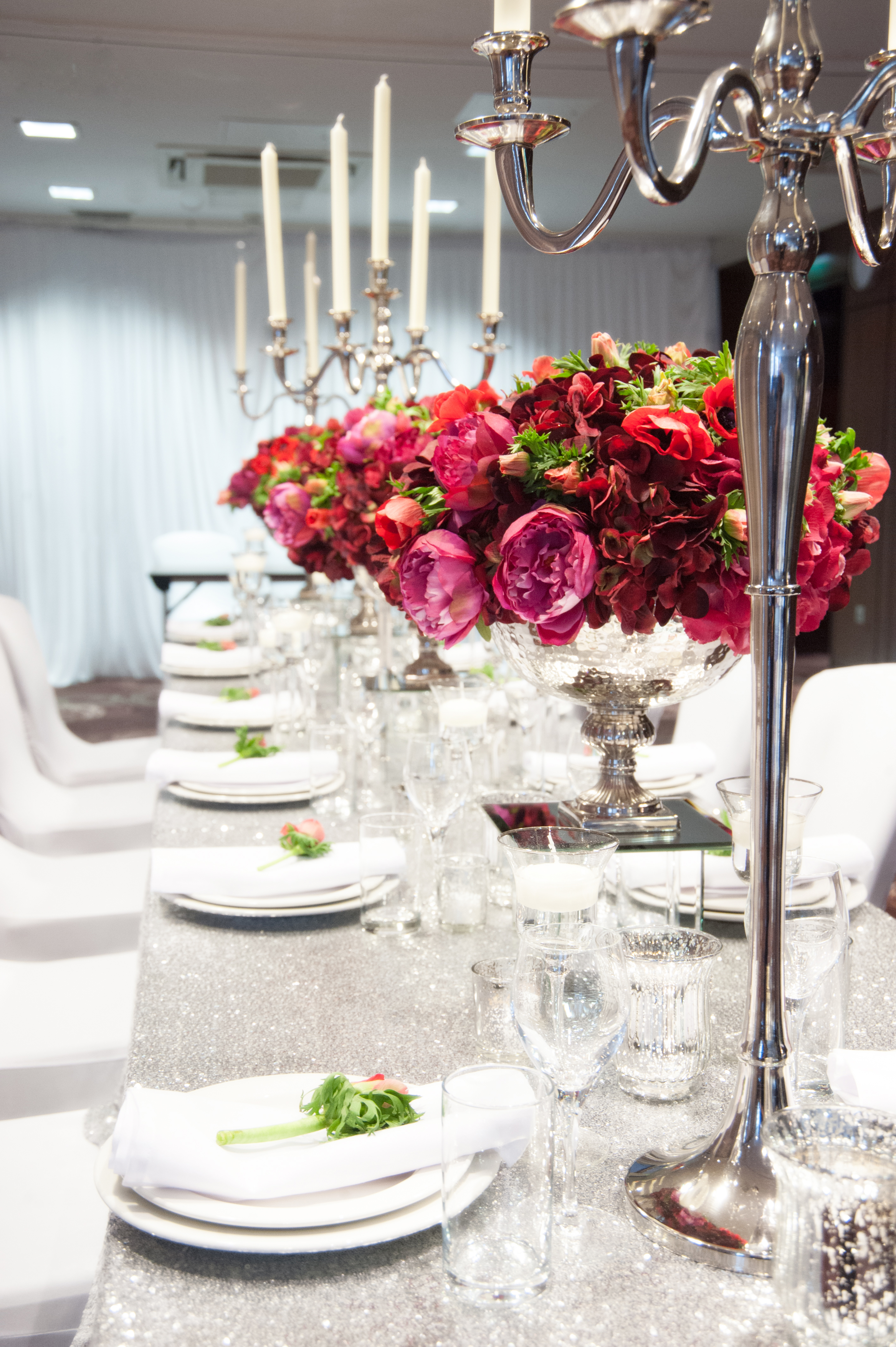 Elegant dining table with floral centerpieces at Holiday Inn Whitechapel event space.