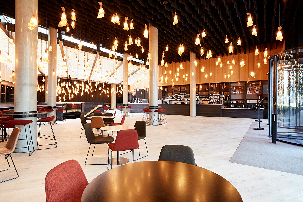 Modern Bridge Theatre foyer with stylish seating, ideal for corporate events and gatherings. - Banner