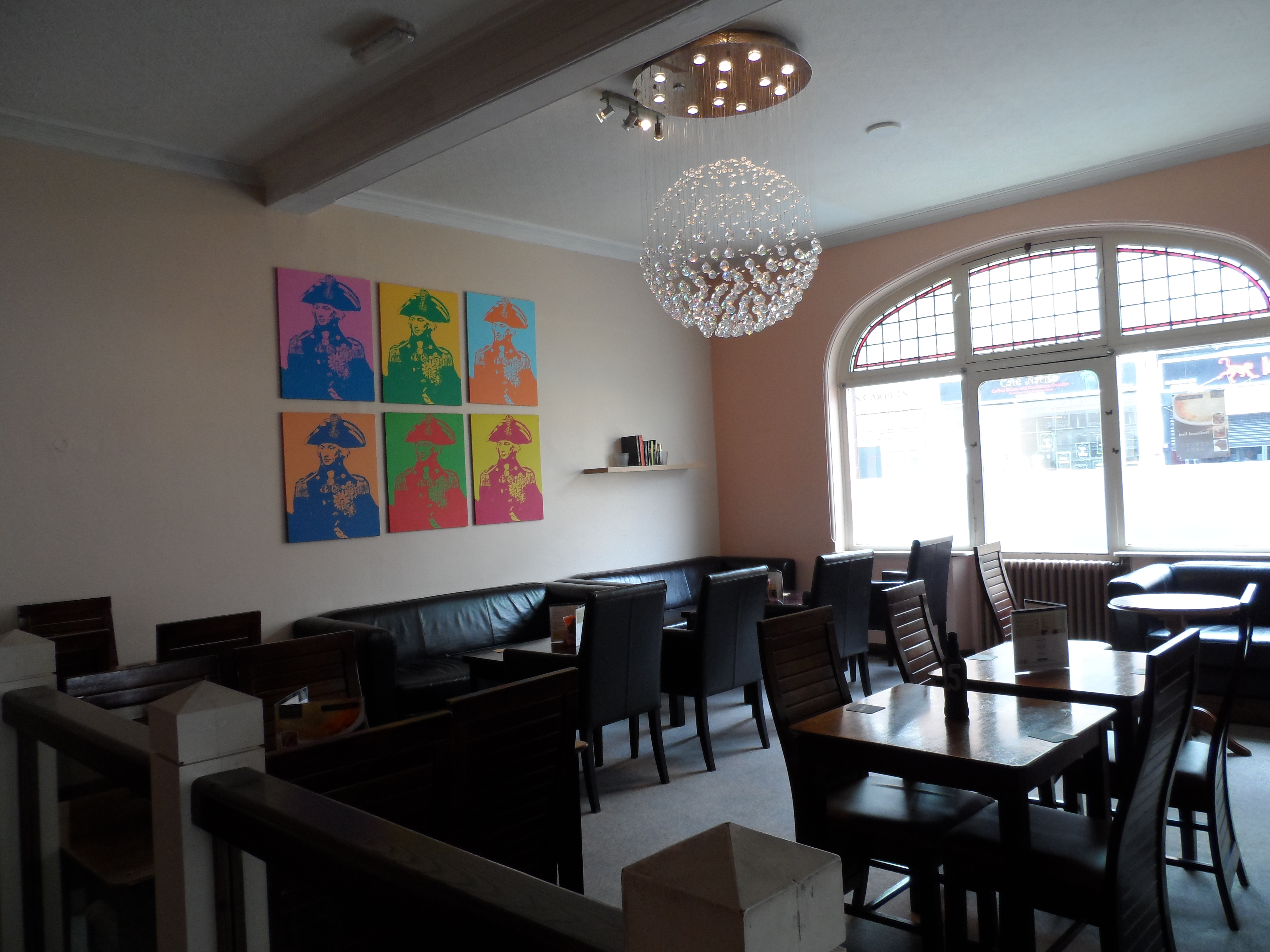 Modern event space at The Nelson Arms with vibrant artwork, ideal for networking. - Banner
