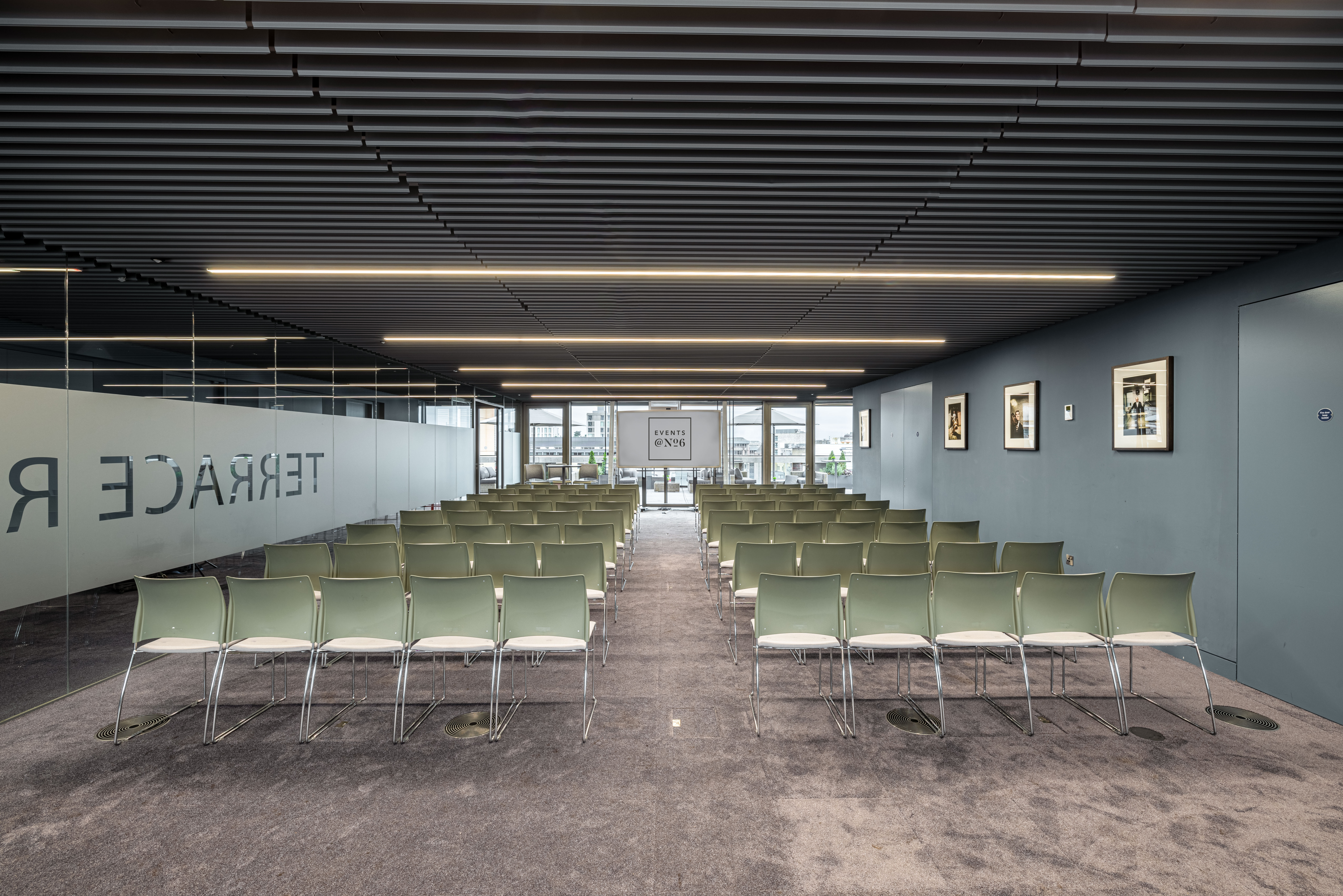 Modern Terrace Room meeting space with minimalist chairs, ideal for presentations and workshops.