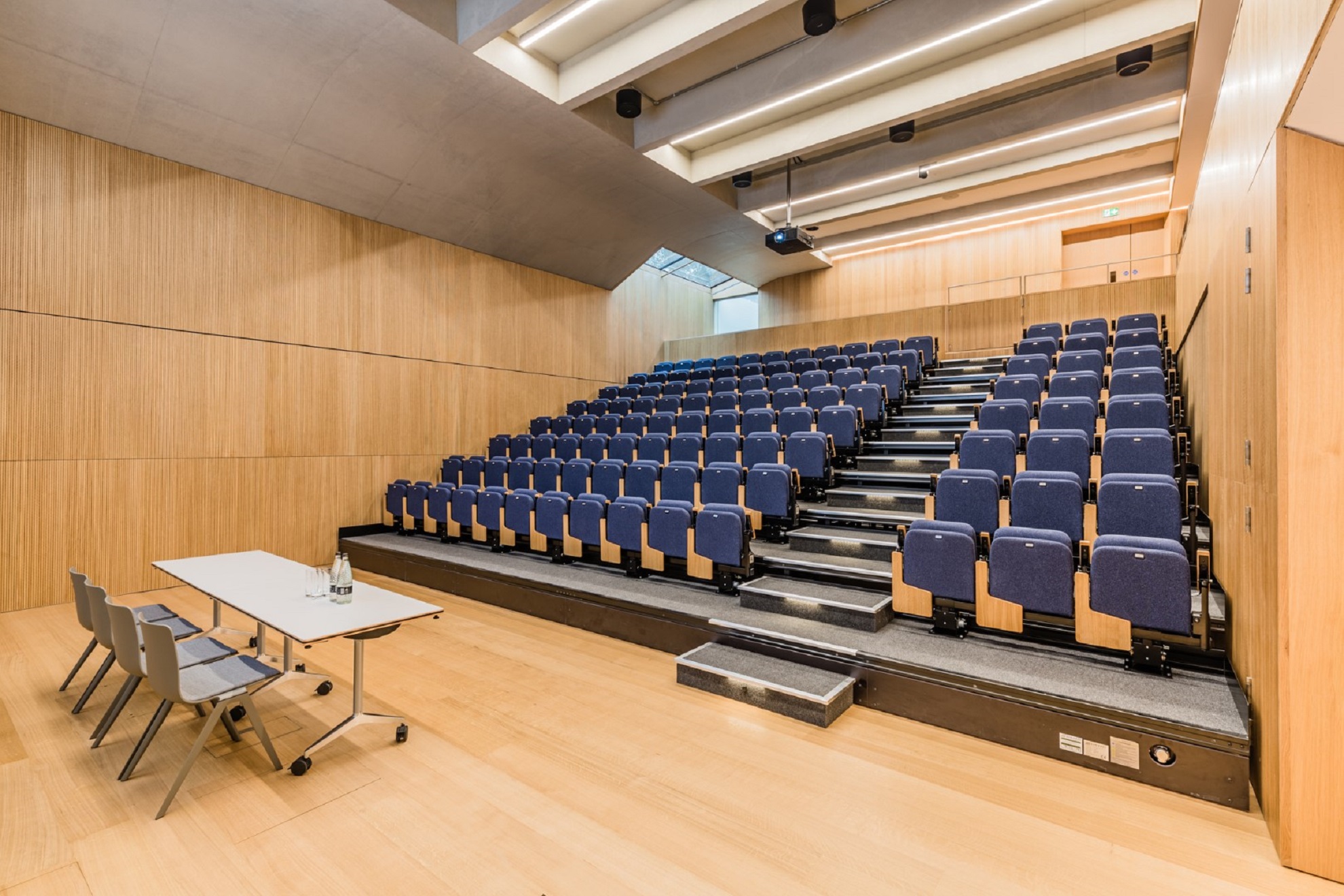 Modern auditorium at Ashworth Centre, tiered seating for presentations and lectures.