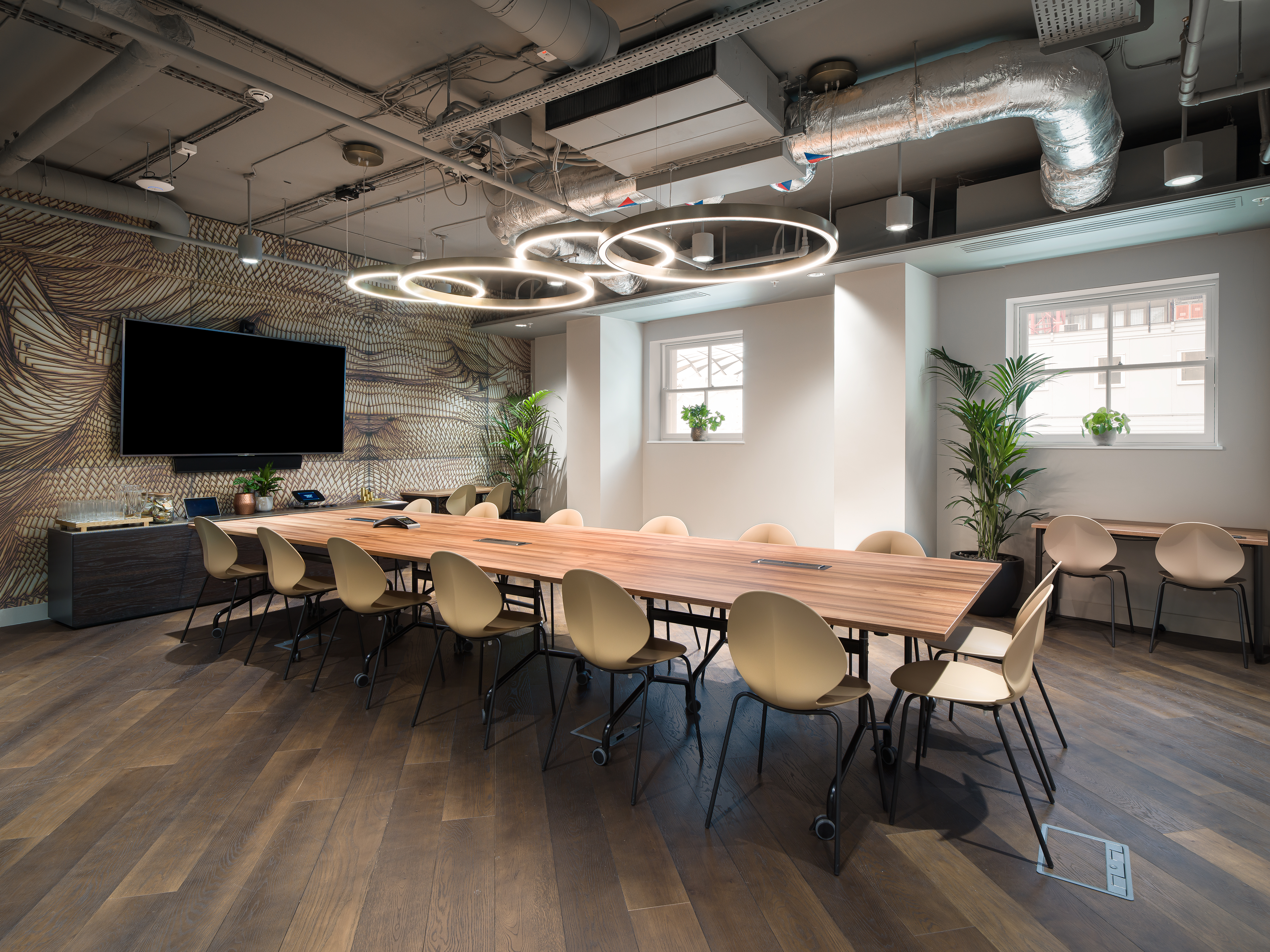Modern conference room with sleek table and natural light for productive meetings.