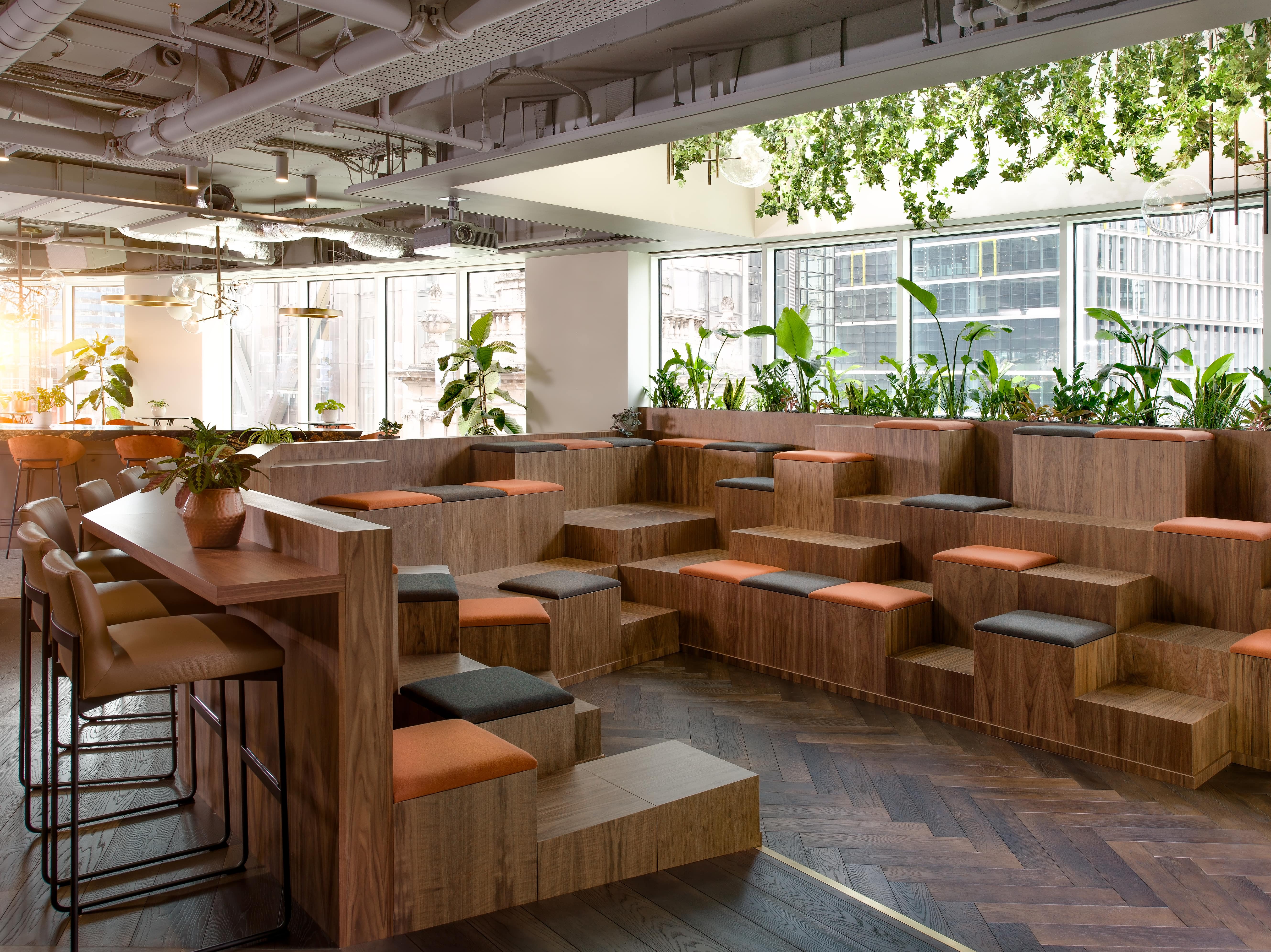 Versatile auditorium with tiered seating and greenery for creative workshops in Liverpool.