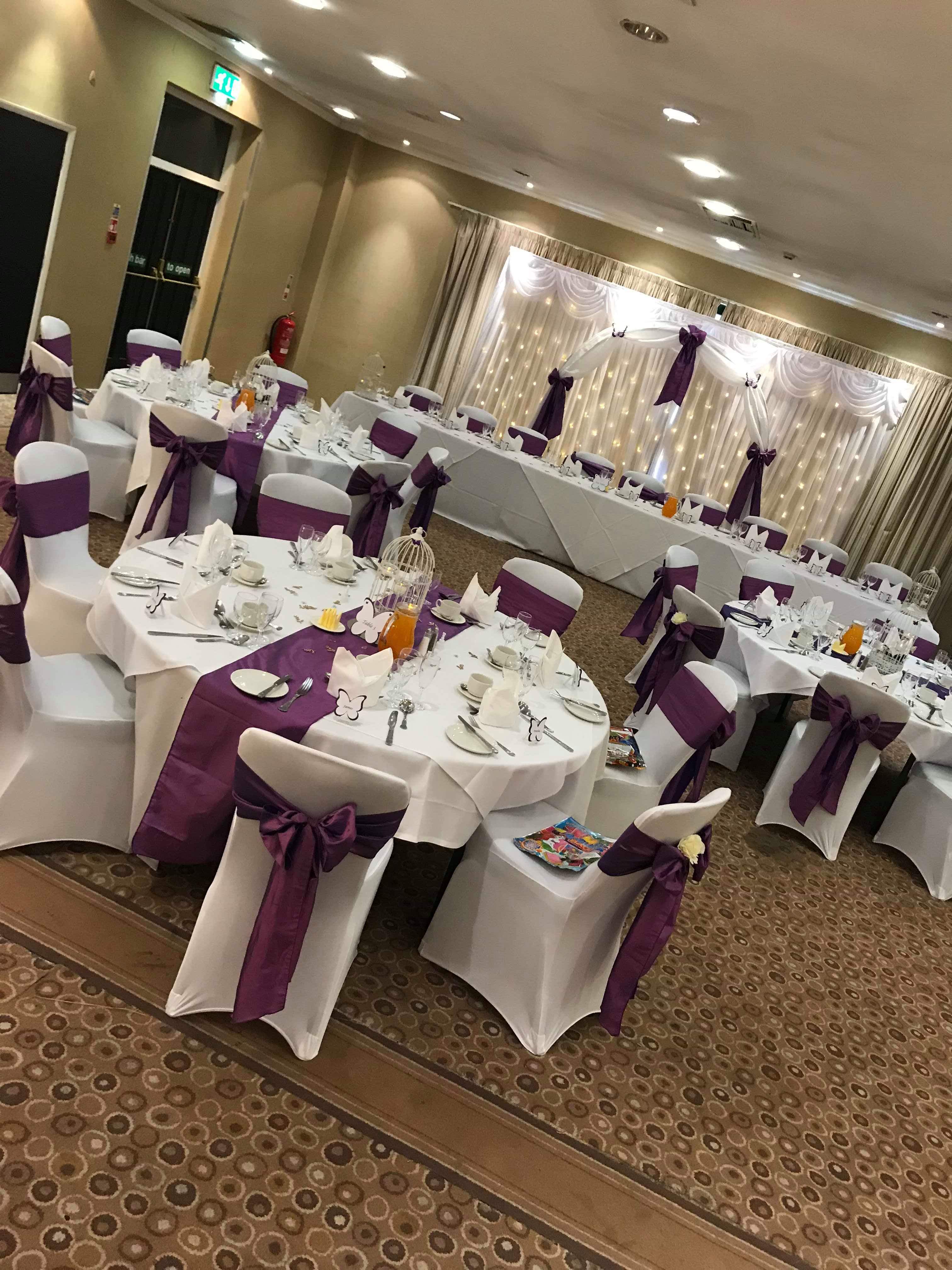 William Duesbury at elegantly arranged Holiday Inn event space for weddings and formal gatherings. - Banner