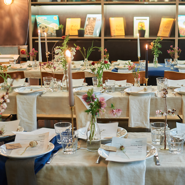 Elegant dining setup at Number 10 London with floral centerpieces for events. - Banner