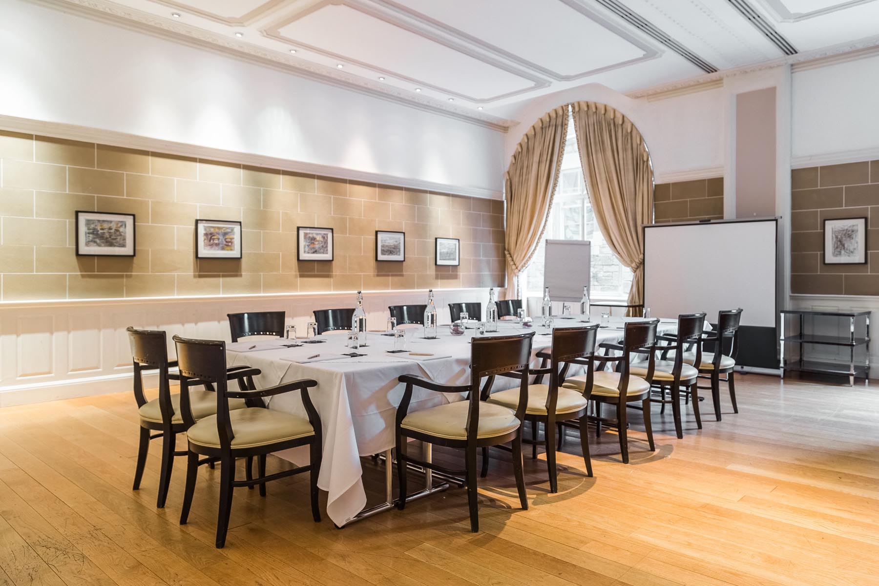 Elegant meeting room in Scotsman Hotel, ideal for professional gatherings and presentations.