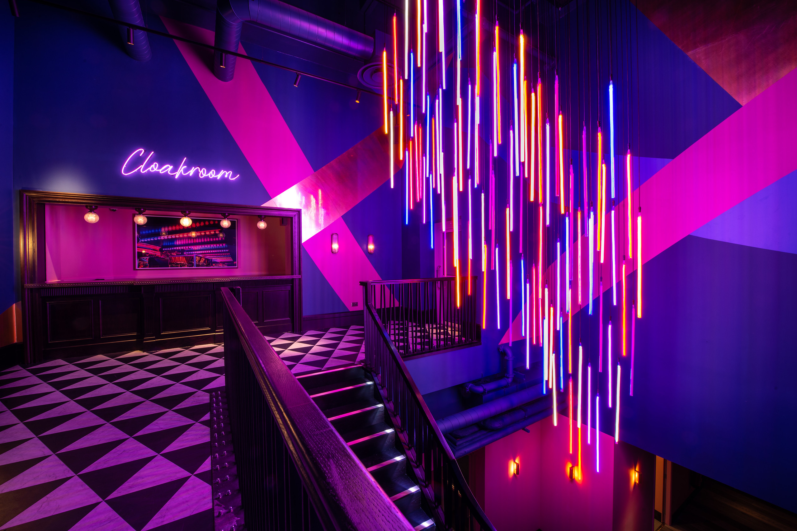 Vibrant venue entrance with geometric patterns for corporate and social events. - Banner
