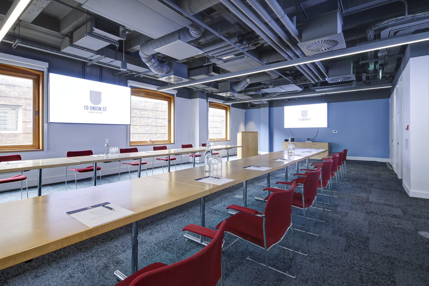 Modern boardroom, dual screens, meeting event
