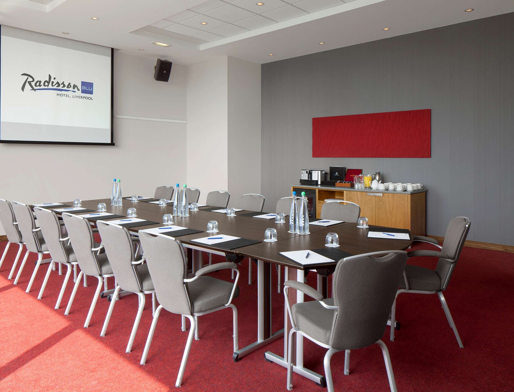 Corporate meeting room at Radisson Blu Liverpool with large table, ideal for events.