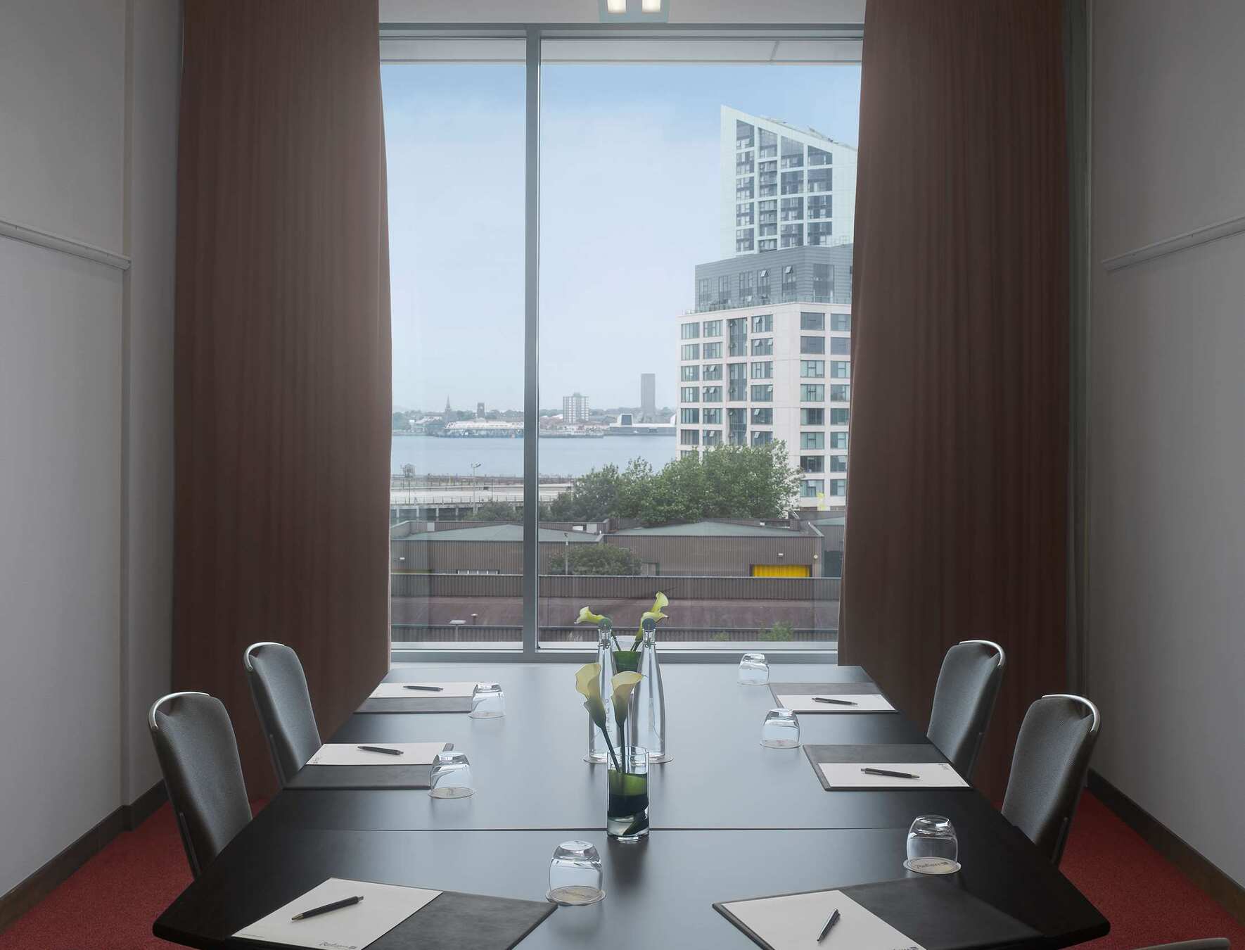 Modern meeting room in Radisson Blu Liverpool with city views for conferences and events.