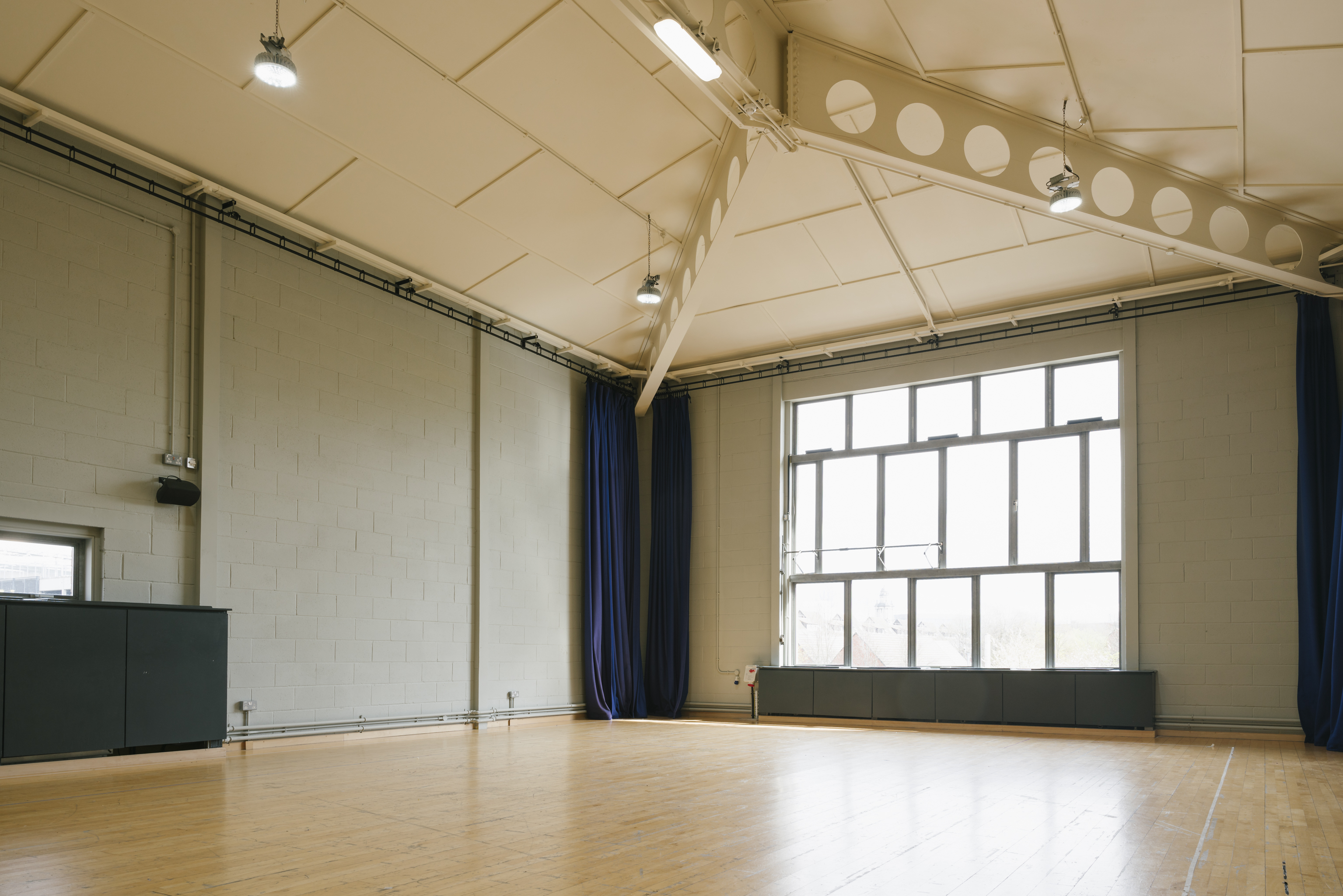 Spacious, well-lit event space with high ceilings for meetings and workshops at Contact Theatre.