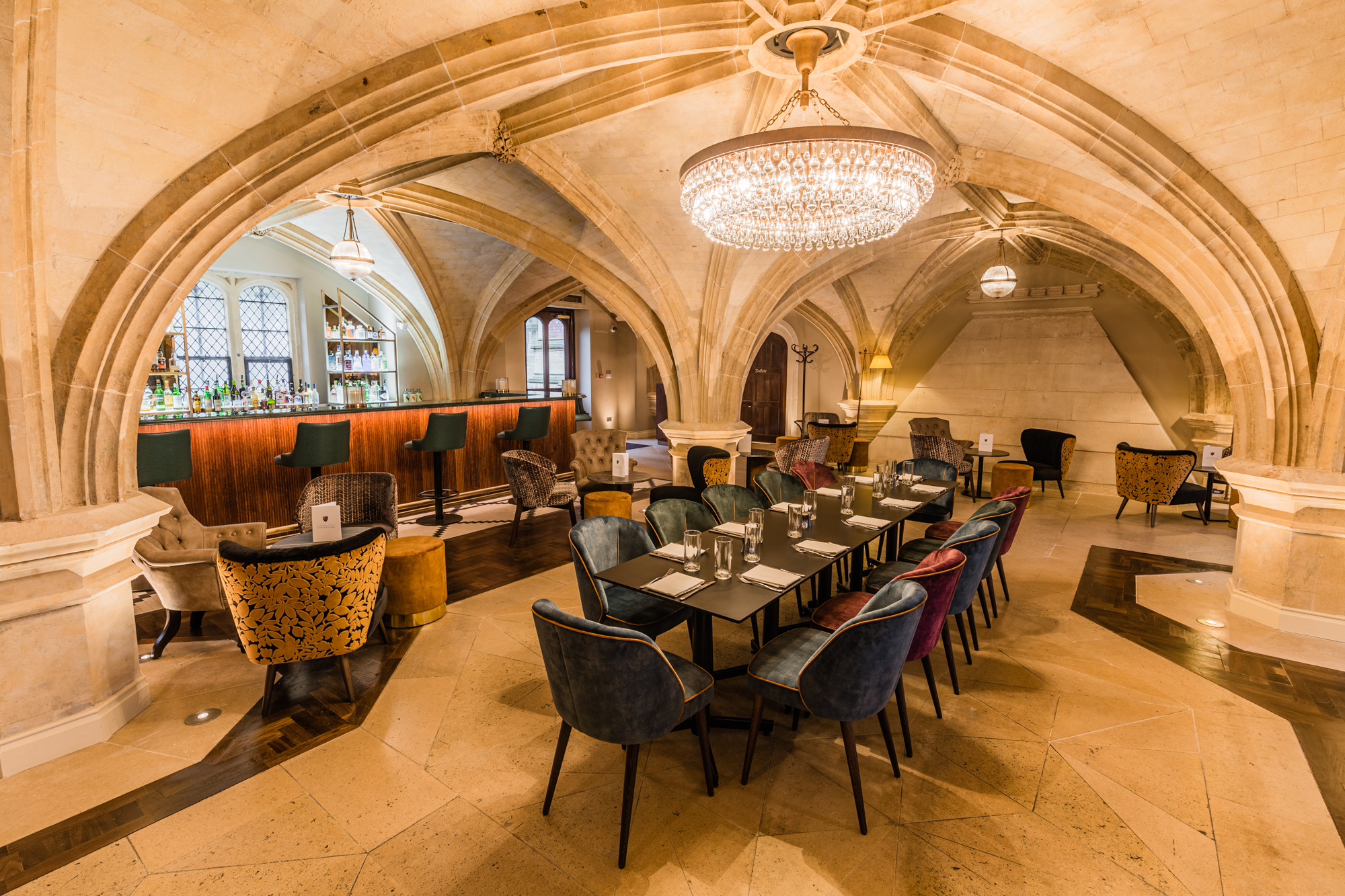 Elegant Members' Common Room with chandelier, perfect for upscale events and gatherings.