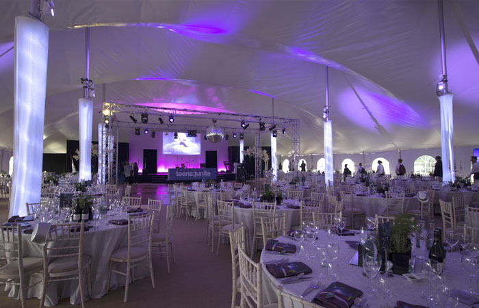 Elegant Mega Marquee event space with round tables, perfect for weddings and corporate events. - Banner