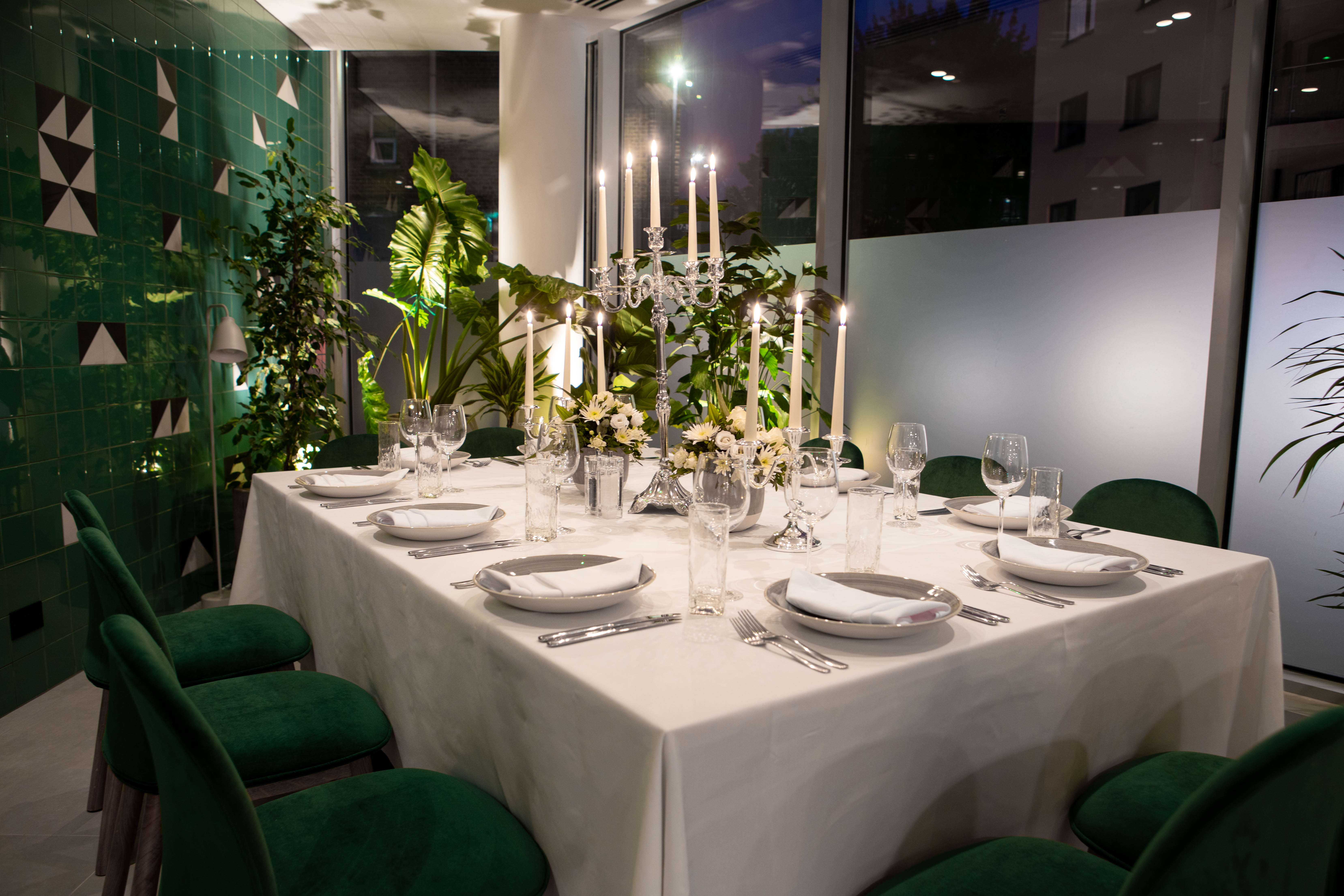 Elegant dining table in Green Room, Holiday Inn London Whitechapel for upscale events.