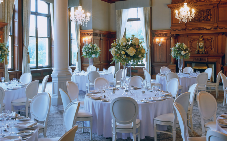 Elegant banquet hall at The Principal York with floral centerpieces for upscale events.
