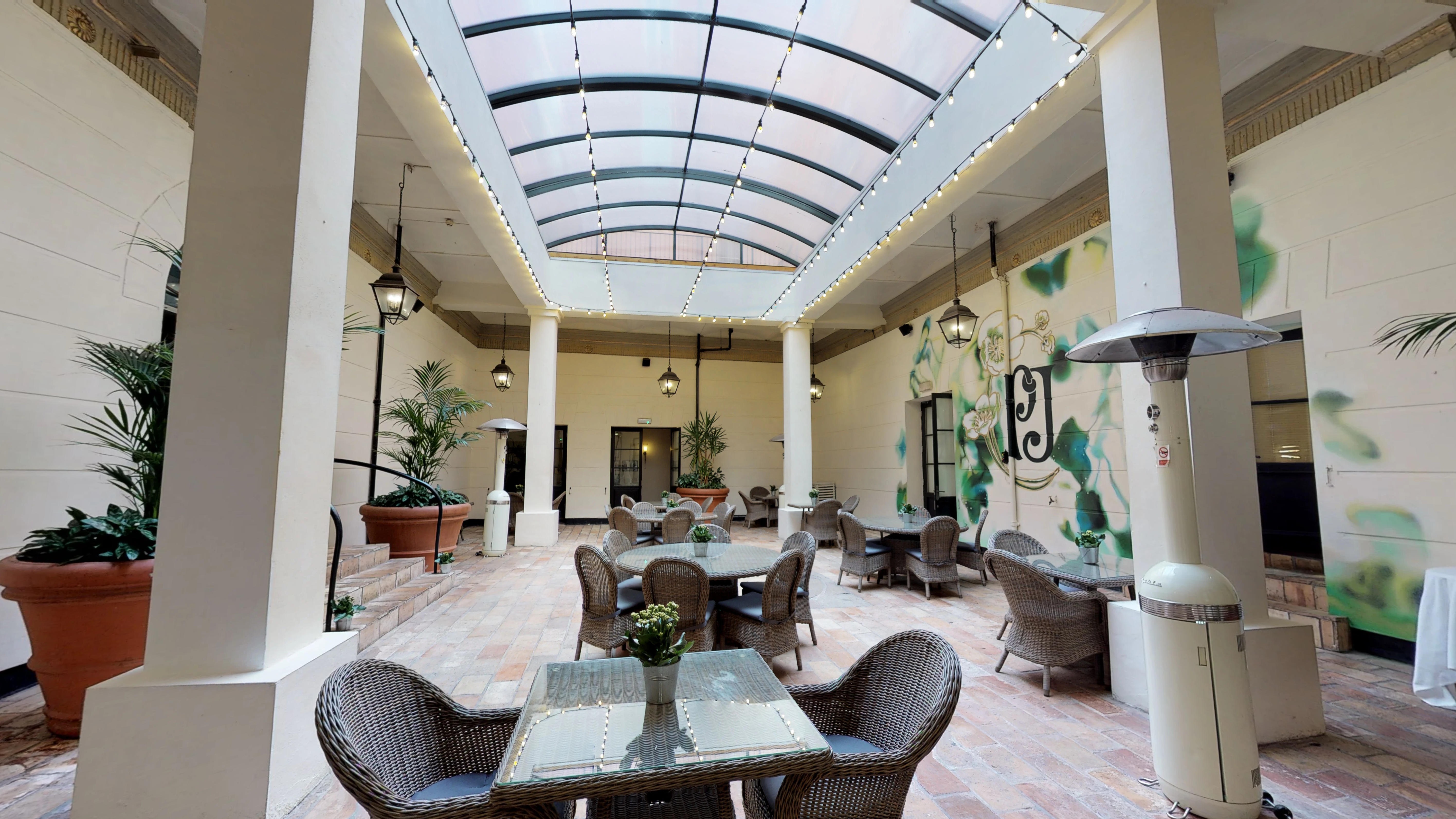 Indoor-outdoor event space with glass ceiling at Hotel du Vin Birmingham for receptions.