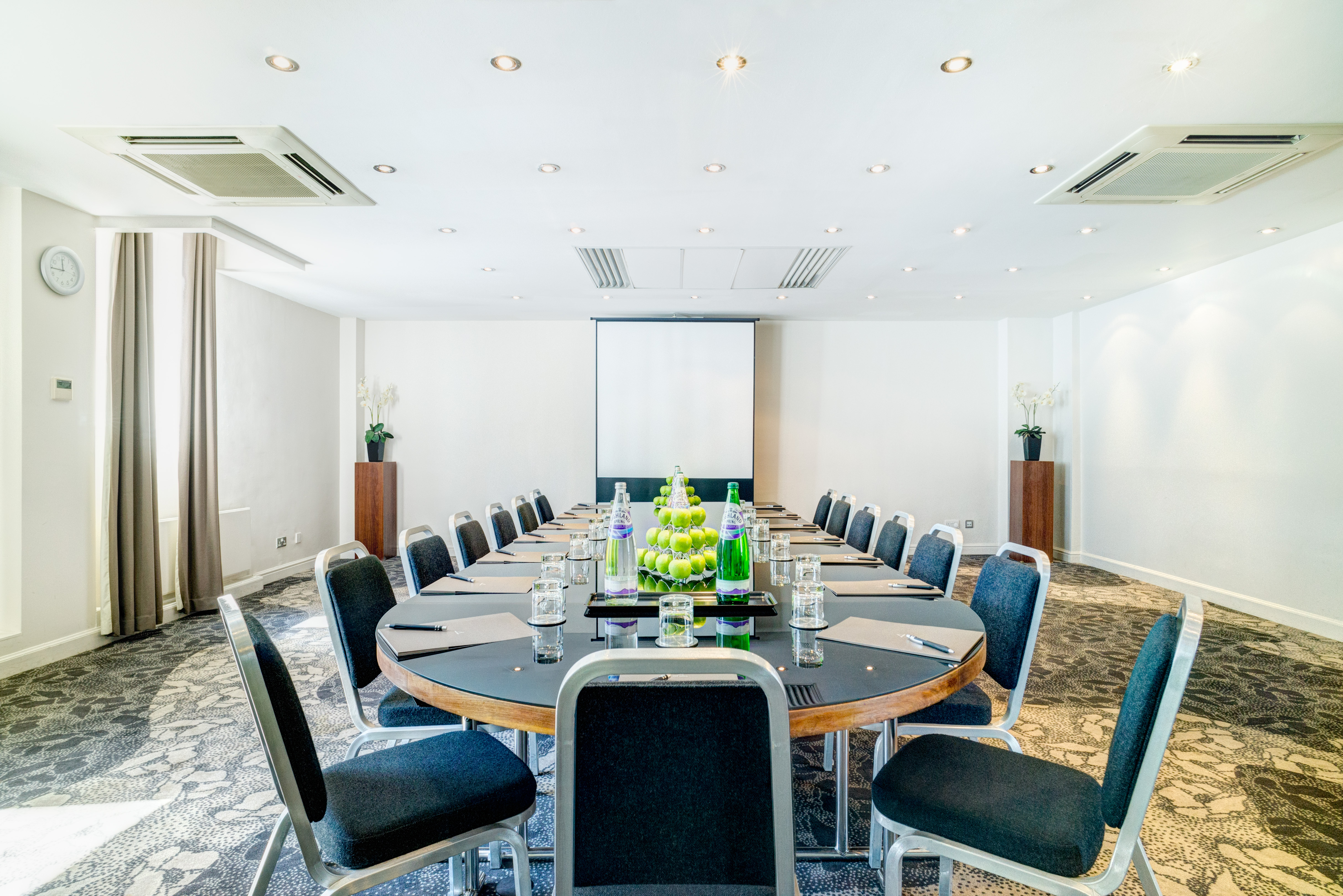 Bright meeting room at Apex Grassmarket Hotel, ideal for corporate events and presentations.