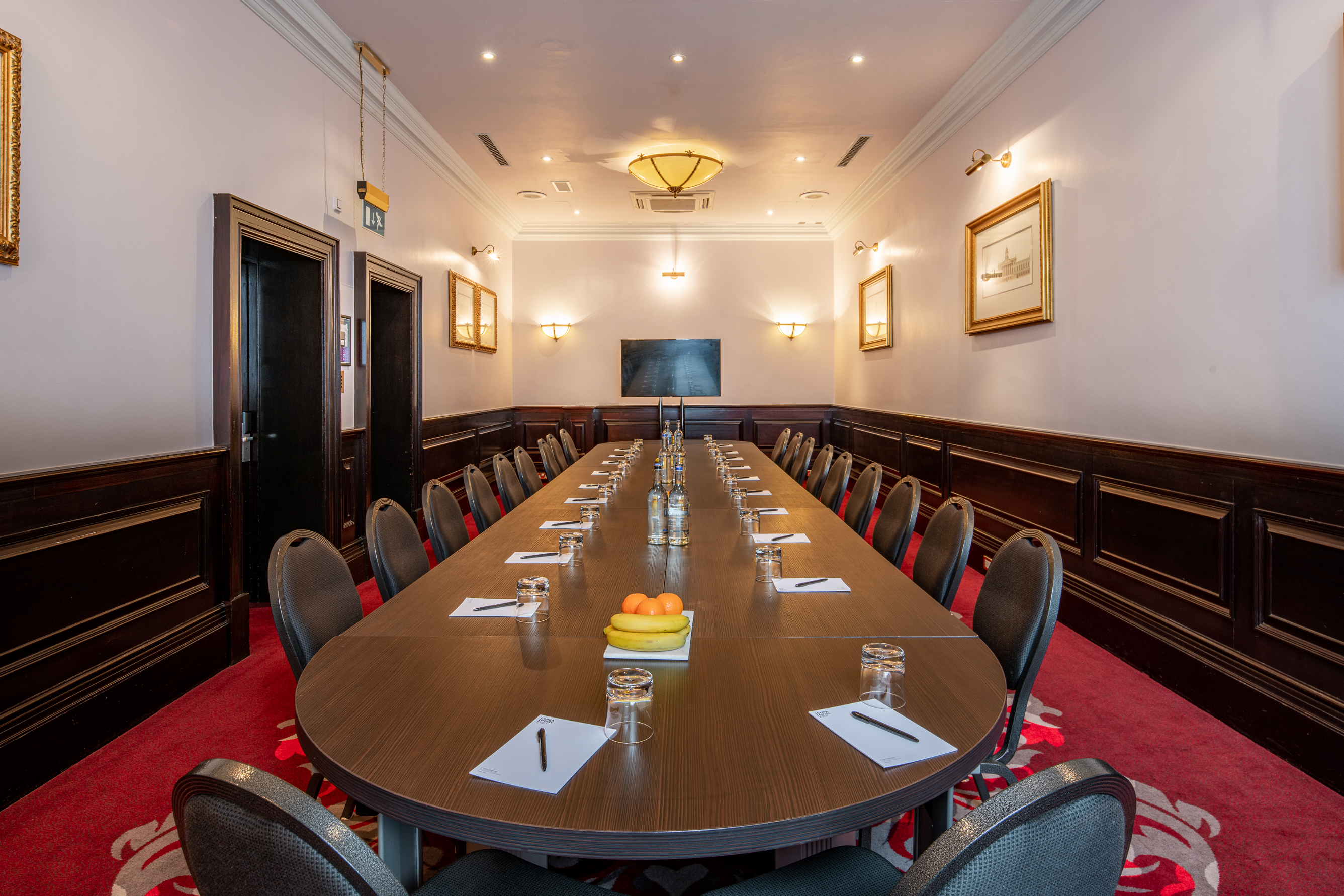 Boardroom at The Clermont Charing Cross, elegant table for professional meetings and events.