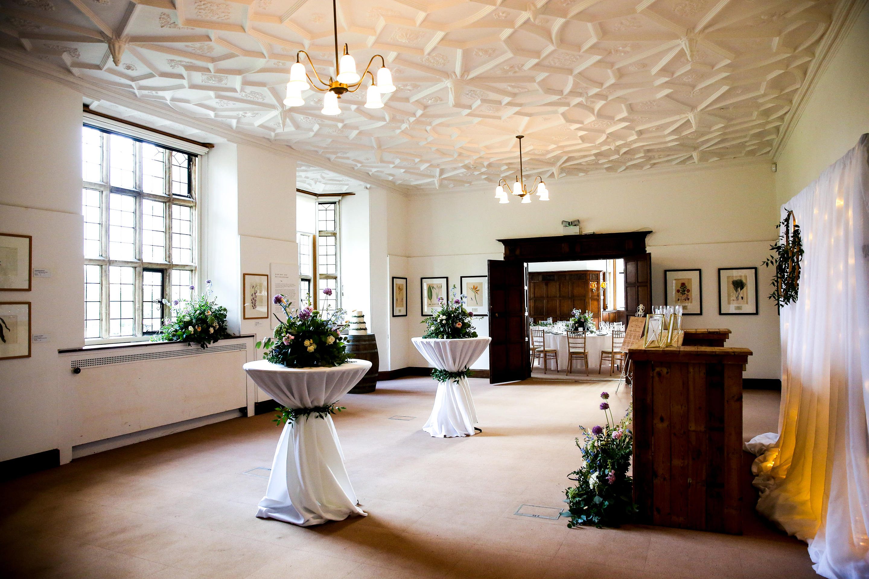 Elegant Mansion Gallery event space with floral decor, ideal for weddings and receptions. - Banner