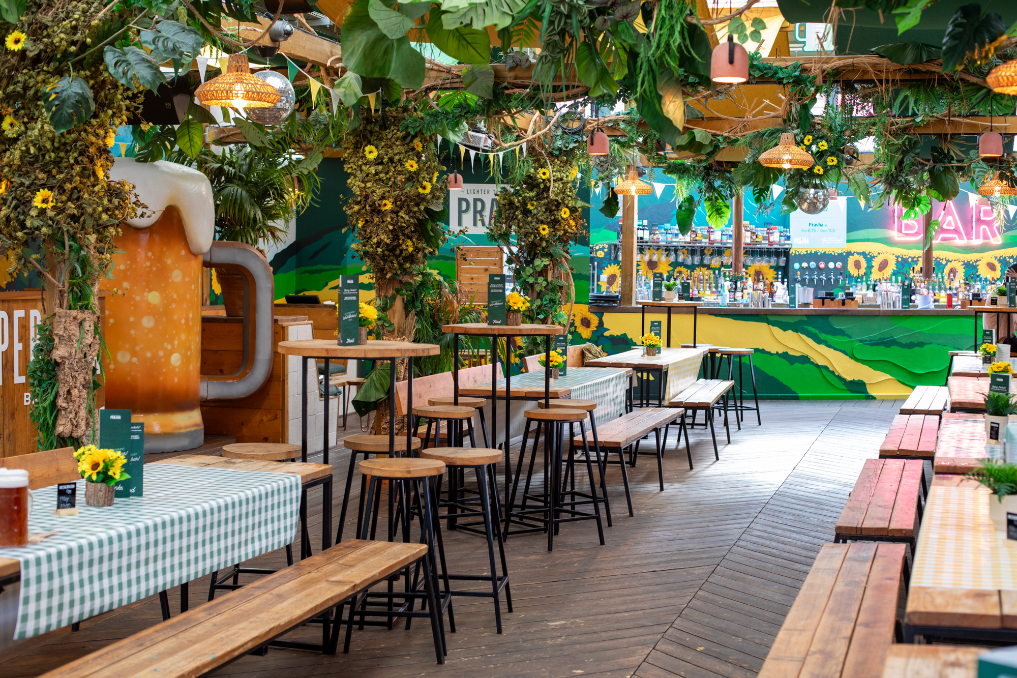 Vibrant event space with rustic tables and greenery at Pergola Brixton for social gatherings.
