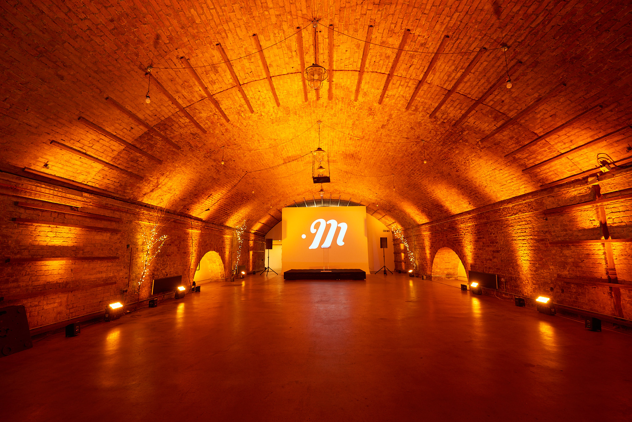 Spacious Studio 1 in MOTEL with warm lighting, ideal for events and presentations.