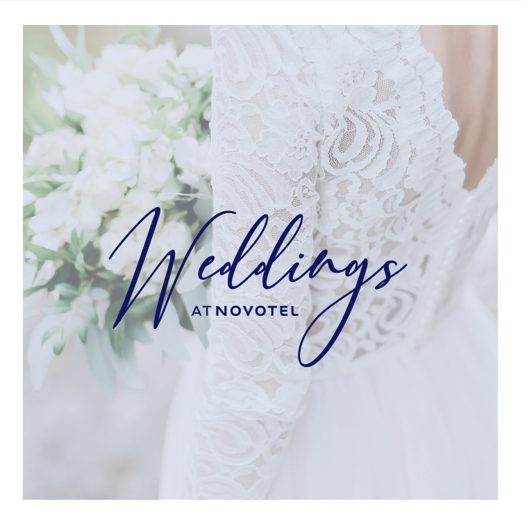 Elegant wedding setup in Hermiston Suite, Novotel Edinburgh Park with lace dress and floral decor.