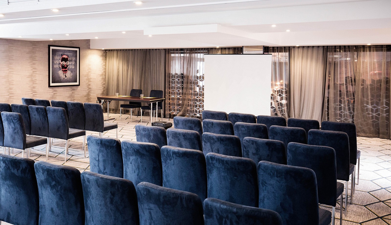 Work + Play 4 meeting space in Malmaison Birmingham with plush navy chairs for corporate events.