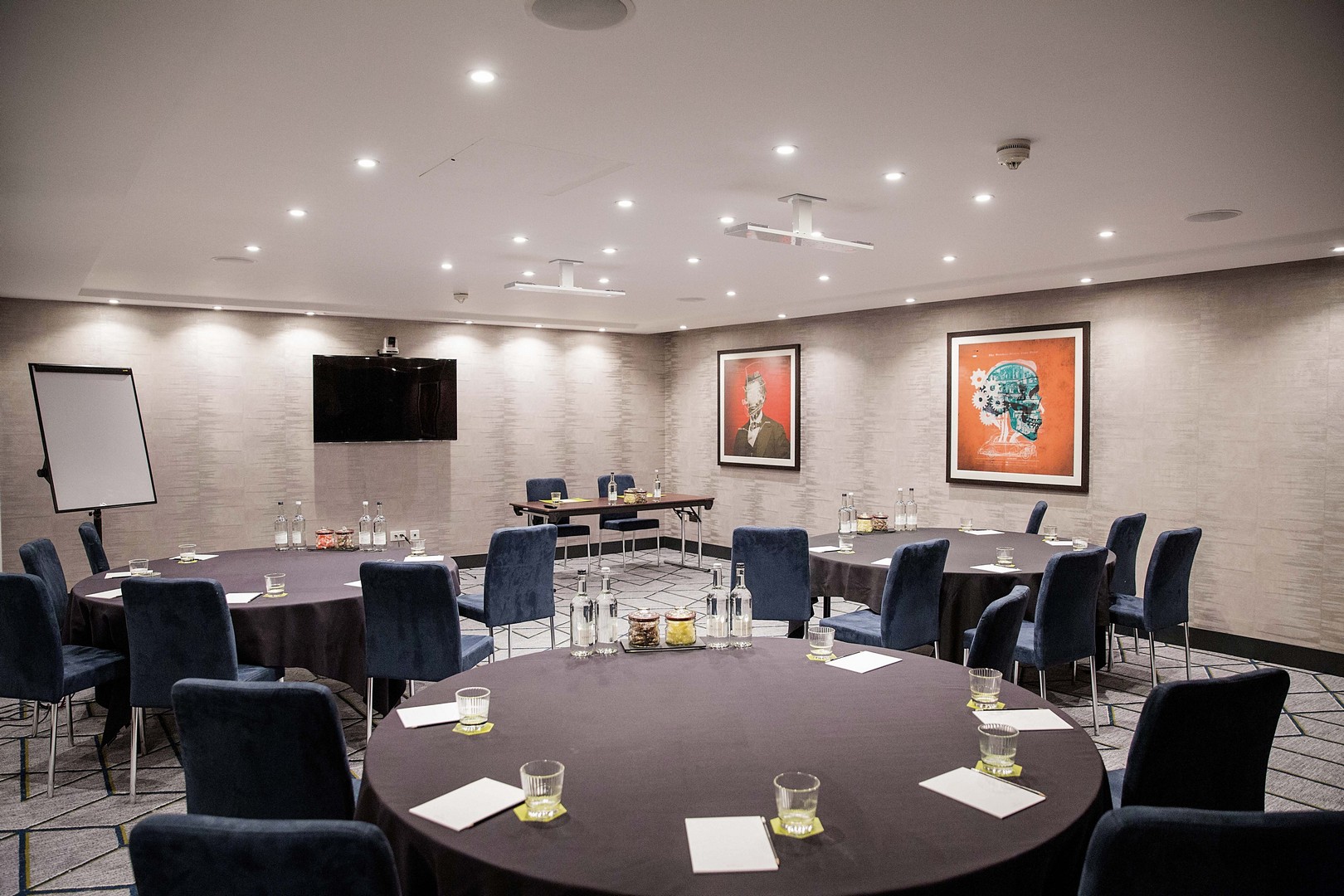 Meeting room in Malmaison Birmingham with round tables, ideal for workshops and conferences.