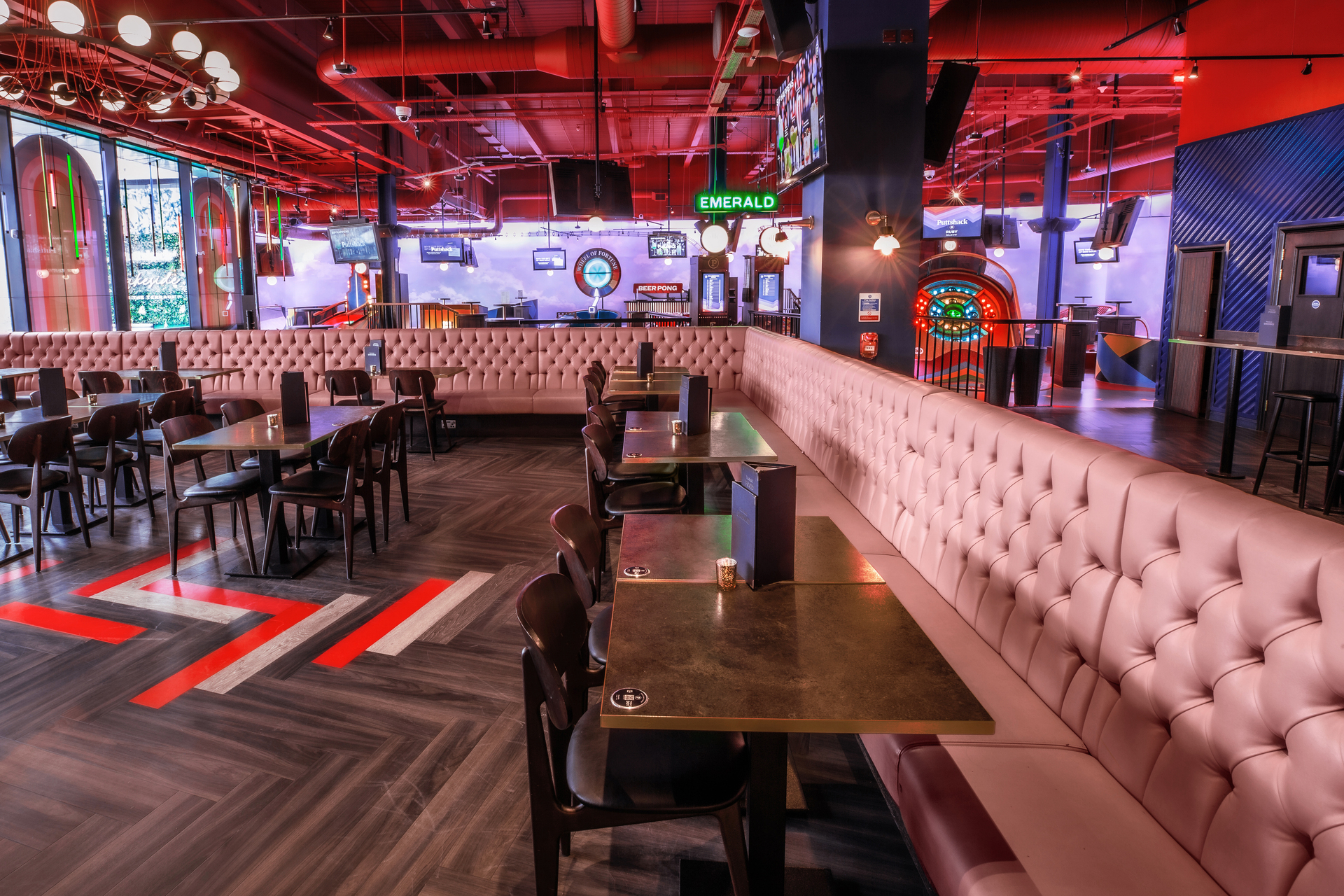 Ruby semi-private event space at Puttshack Lakeside with modern decor for gatherings.