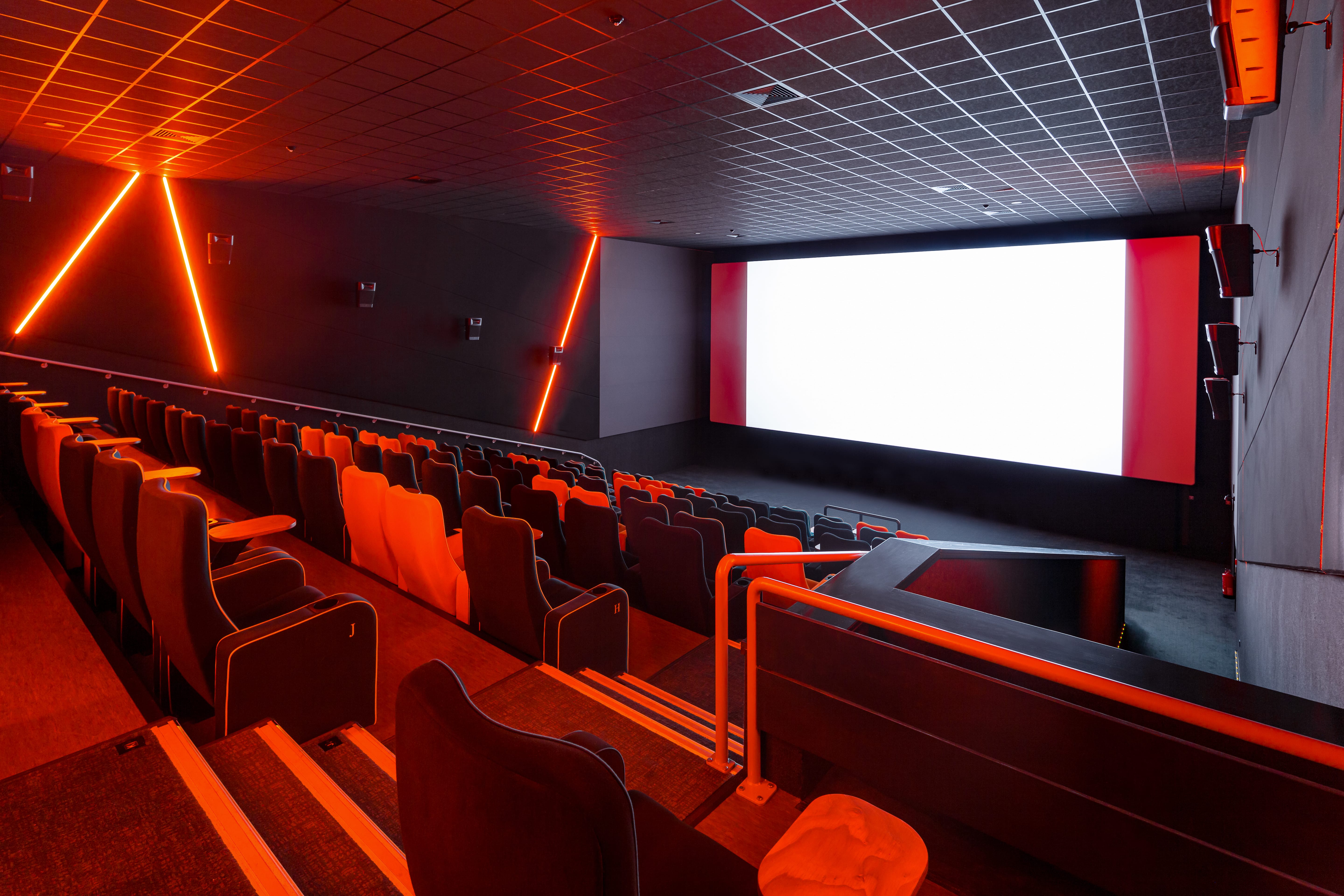Modern cinema auditorium with sleek seating, ideal for corporate events and film screenings.
