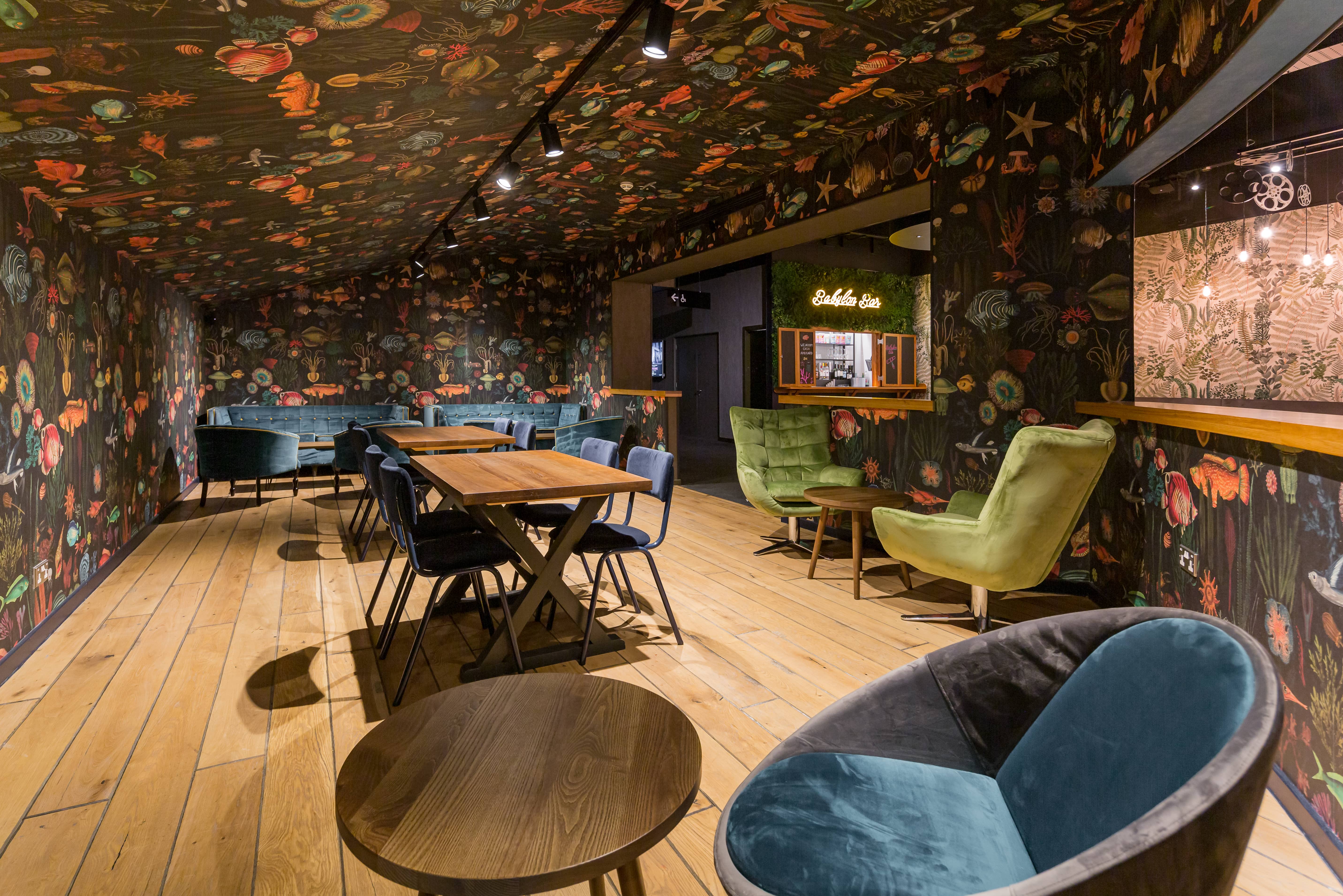 Atlantis Room at The Light Cinema Stockport with floral wallpaper for meetings and events.