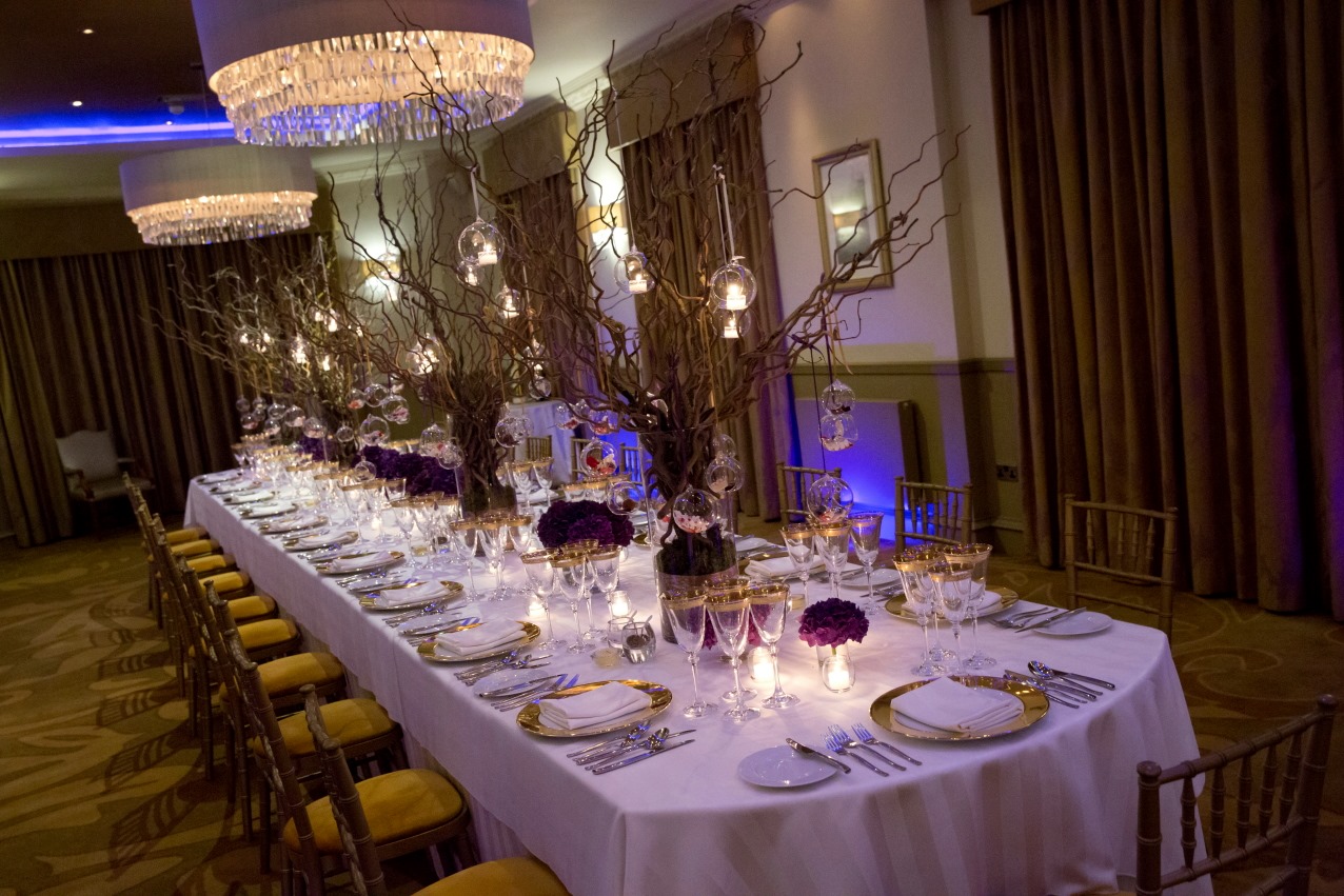 Elegant banquet table with fine china in The Mansion for formal events and celebrations.