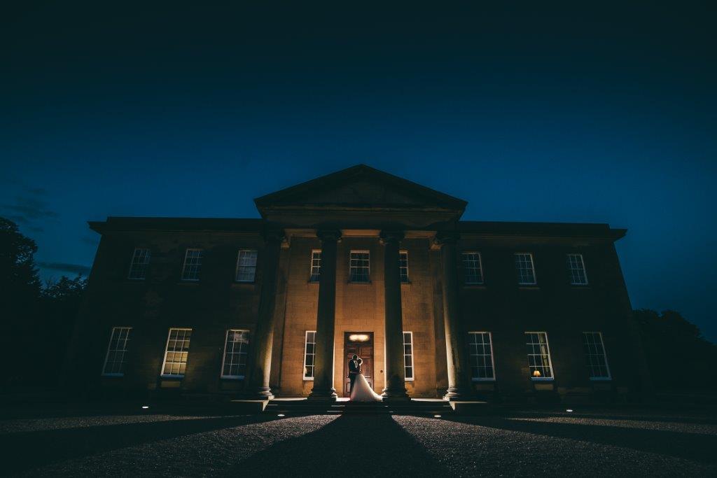 Historic Rise Hall venue illuminated at twilight, ideal for weddings and corporate events.